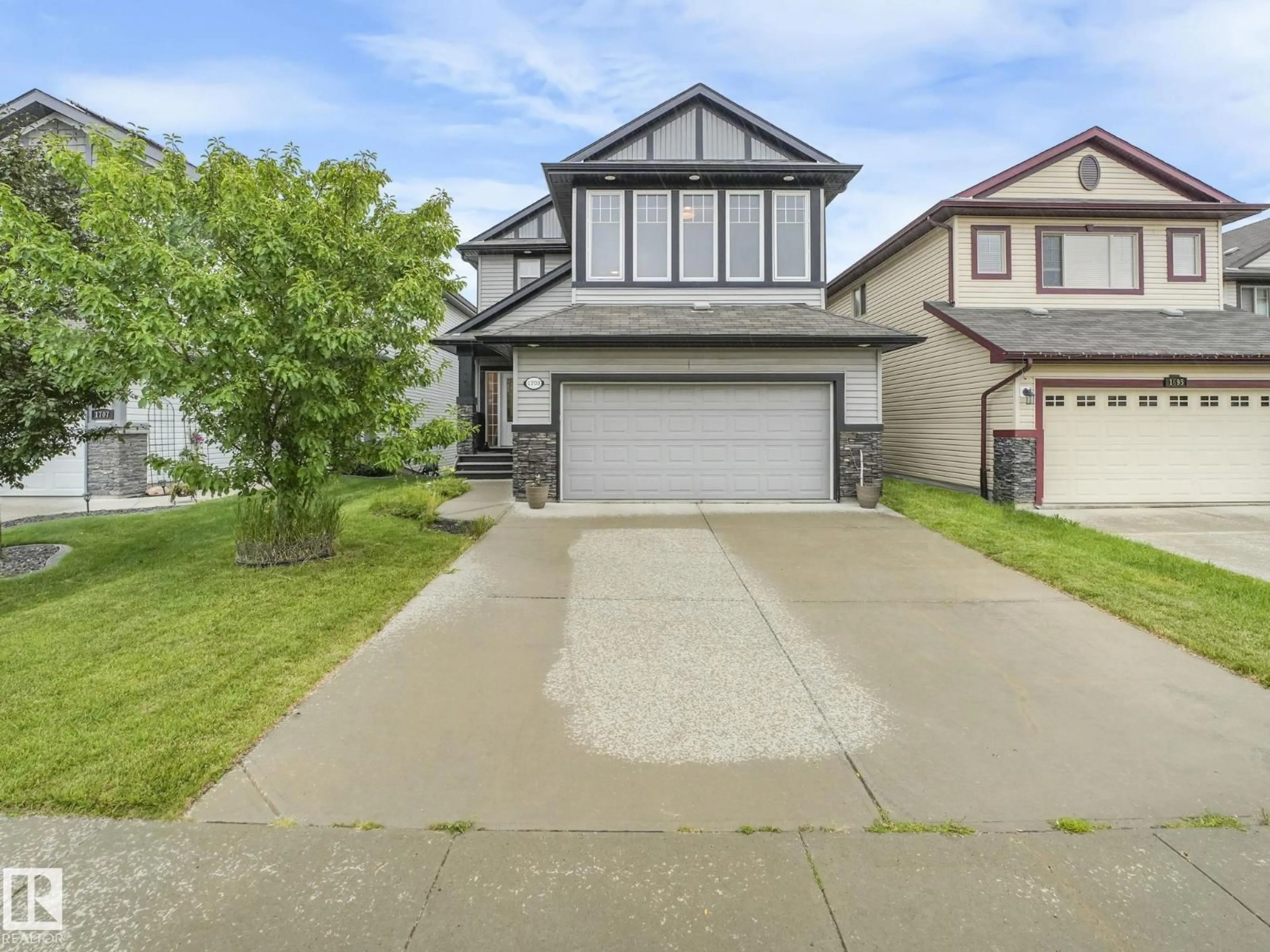 Home with vinyl exterior material, street for NW - 1703 33B ST, Edmonton Alberta T6T0P2
