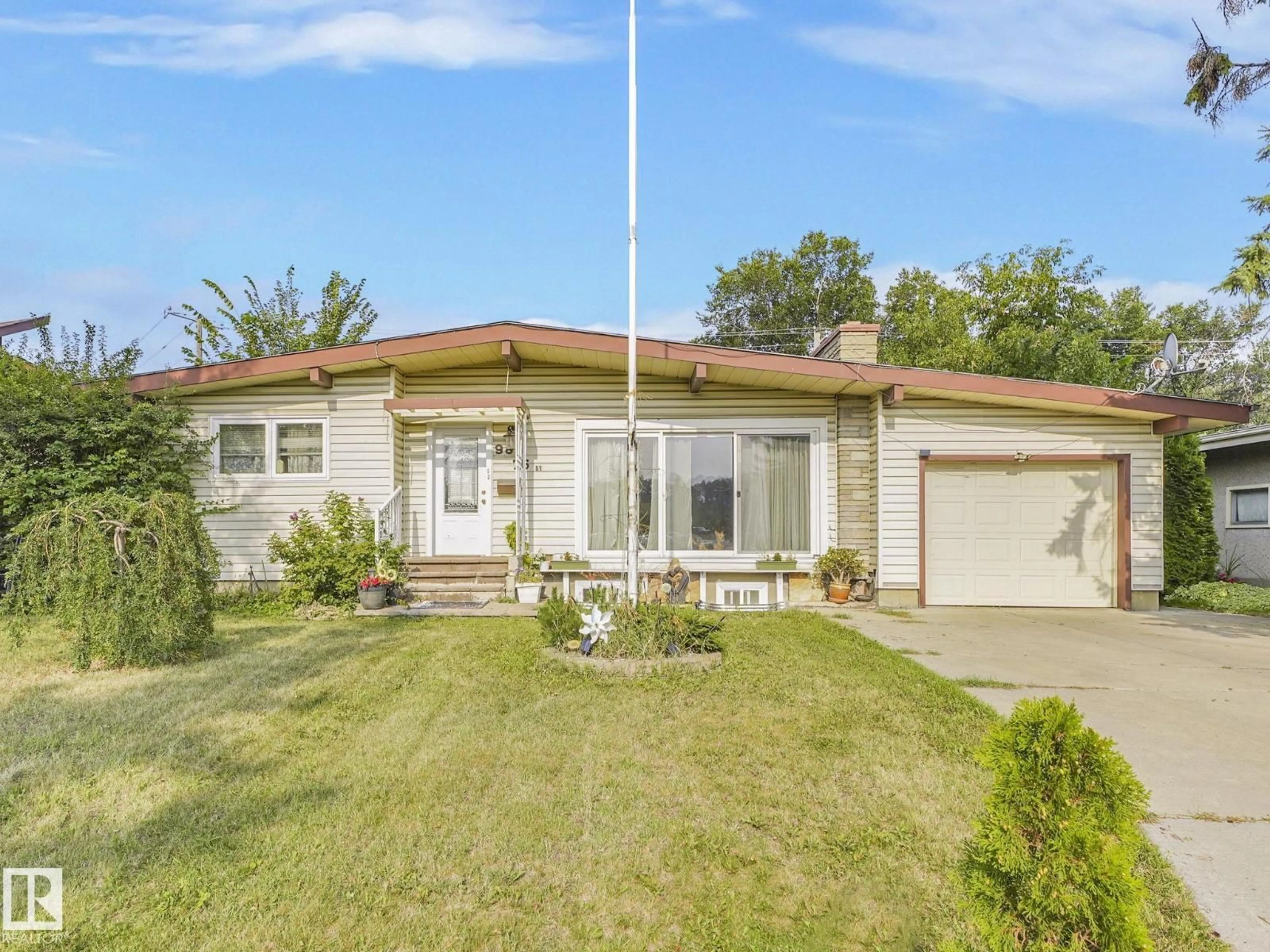 Home with vinyl exterior material, street for NW - 9811 75 ST, Edmonton Alberta T6A2Y8