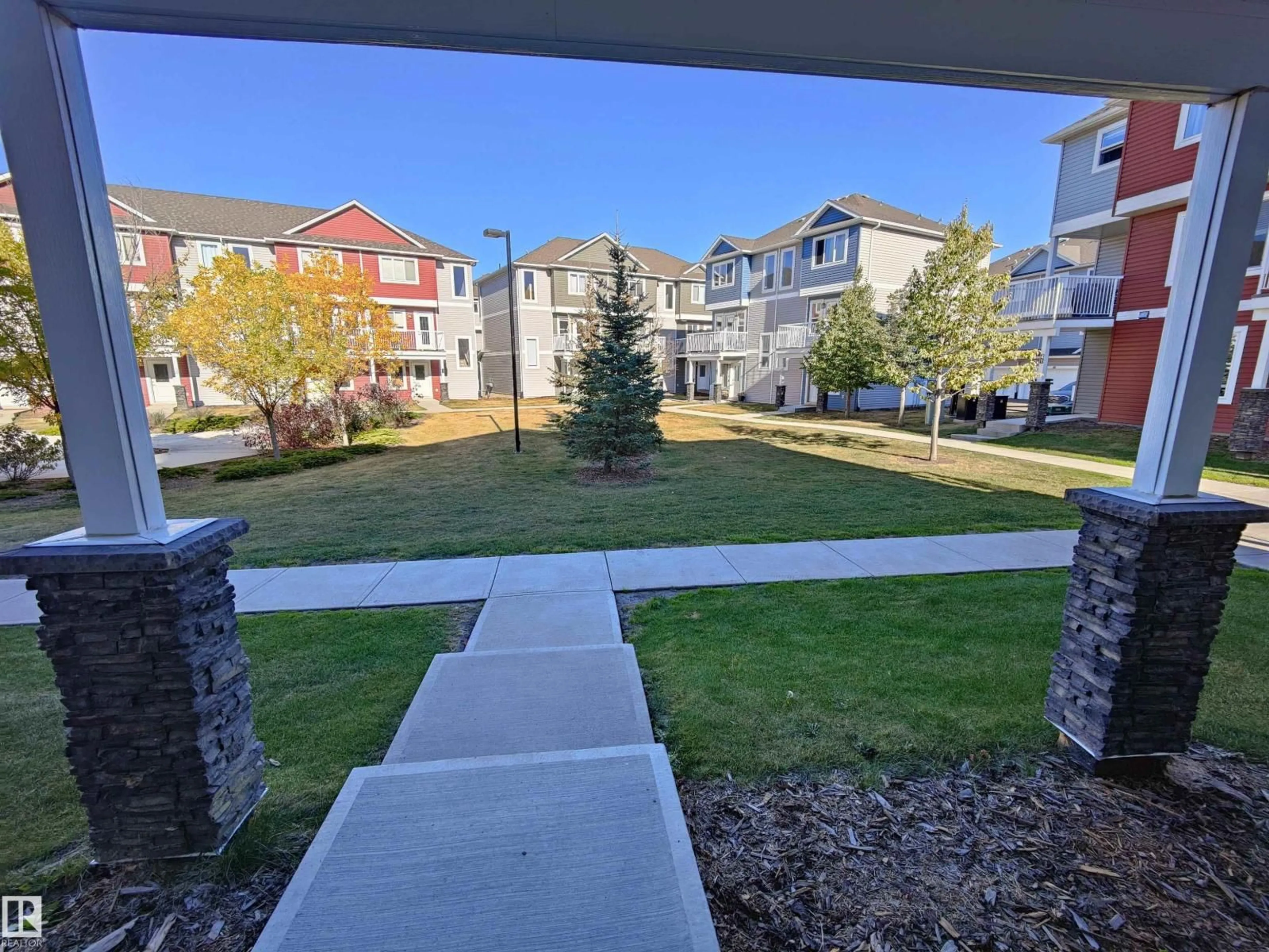A pic from outside/outdoor area/front of a property/back of a property/a pic from drone, street for #46 - 1816 RUTHERFORD RD, Edmonton Alberta T6W2K6