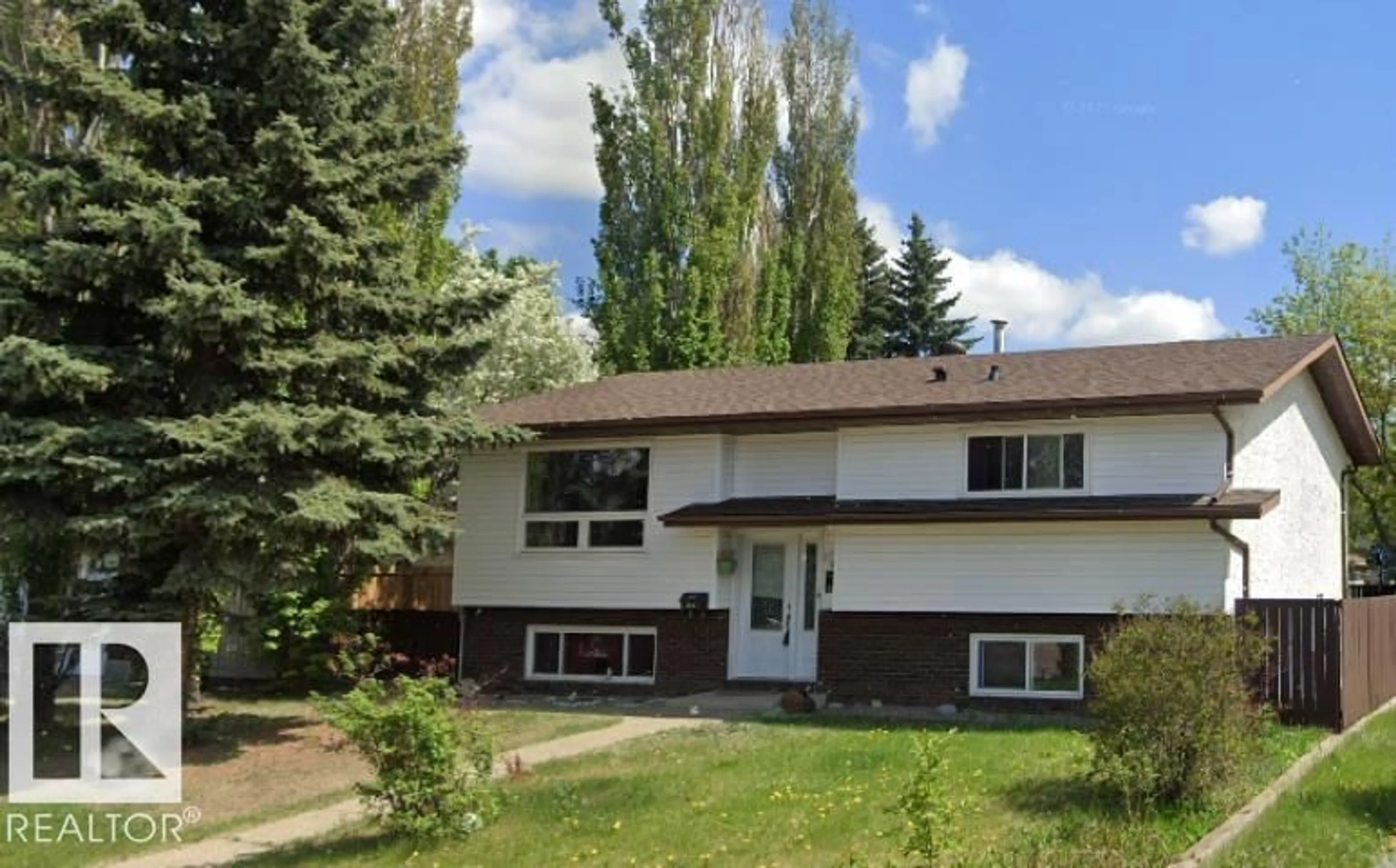 Home with vinyl exterior material, street for NW - 16531 116 ST, Edmonton Alberta T5X4B2