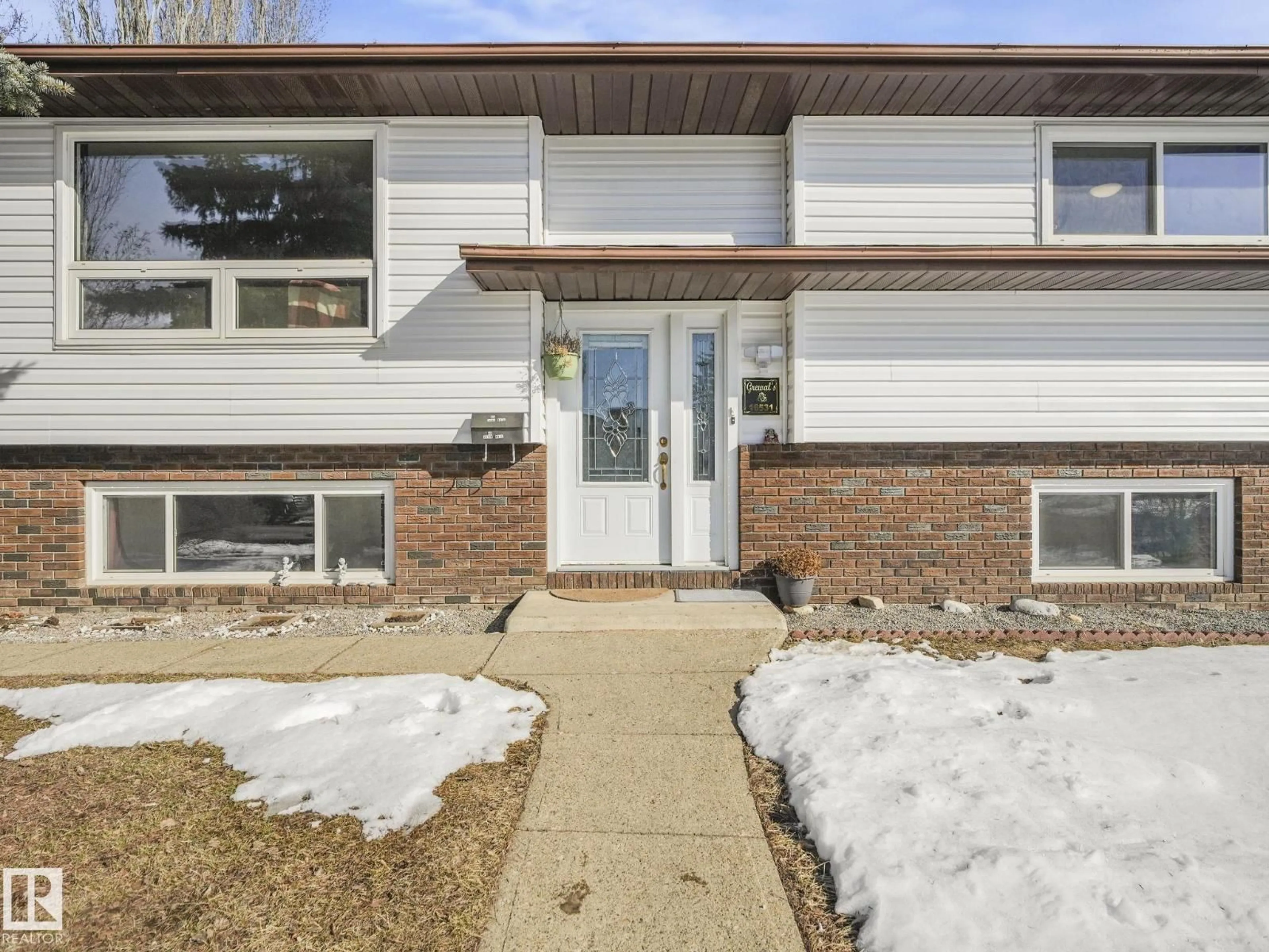 Home with brick exterior material, street for NW - 16531 116 ST, Edmonton Alberta T5X4B2