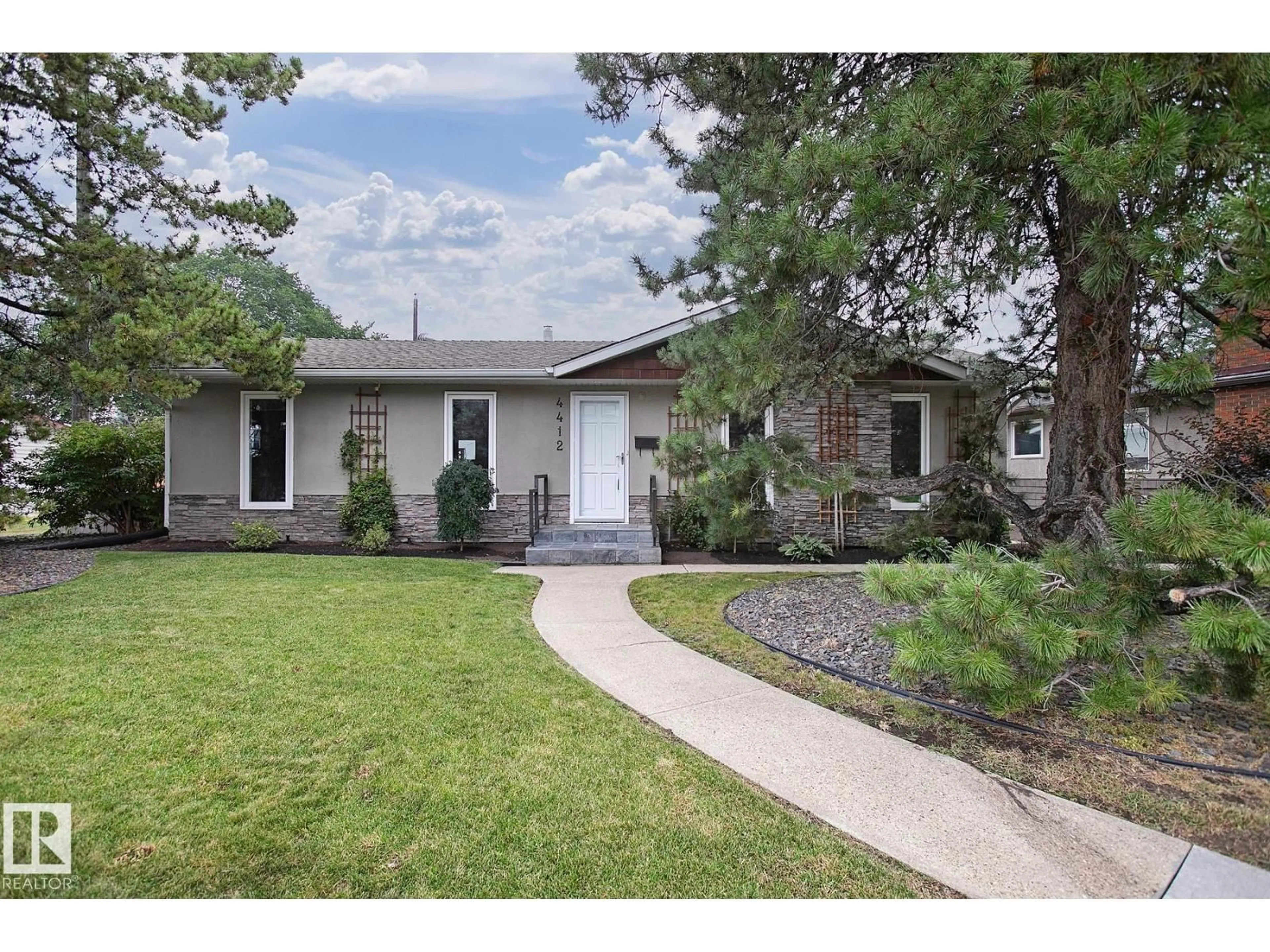 Home with brick exterior material, street for 4412 107 AV, Edmonton Alberta T6A1J5