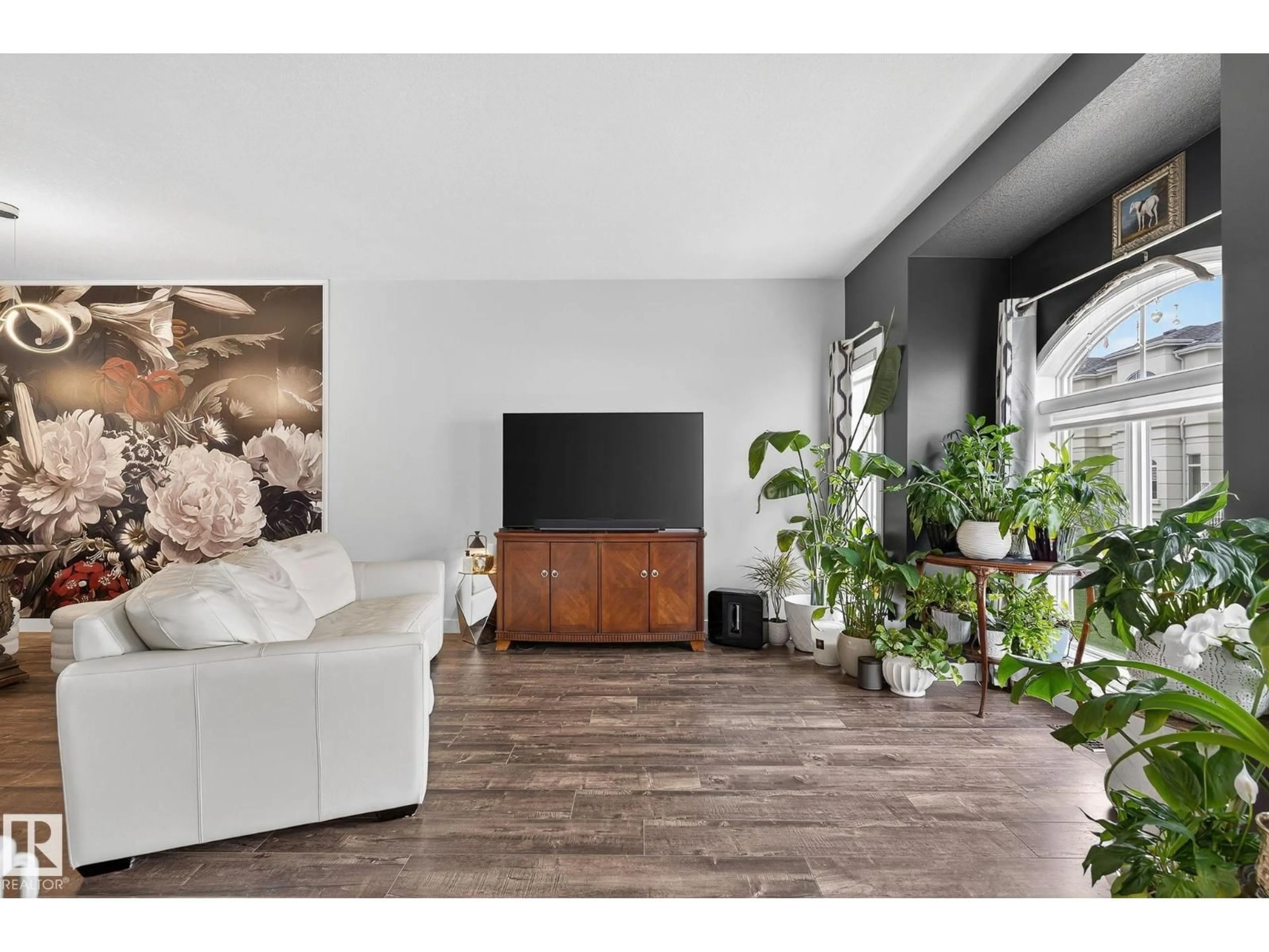 Living room with furniture, wood/laminate floor for 63 723 172 ST SW, Edmonton Alberta T6W2N6