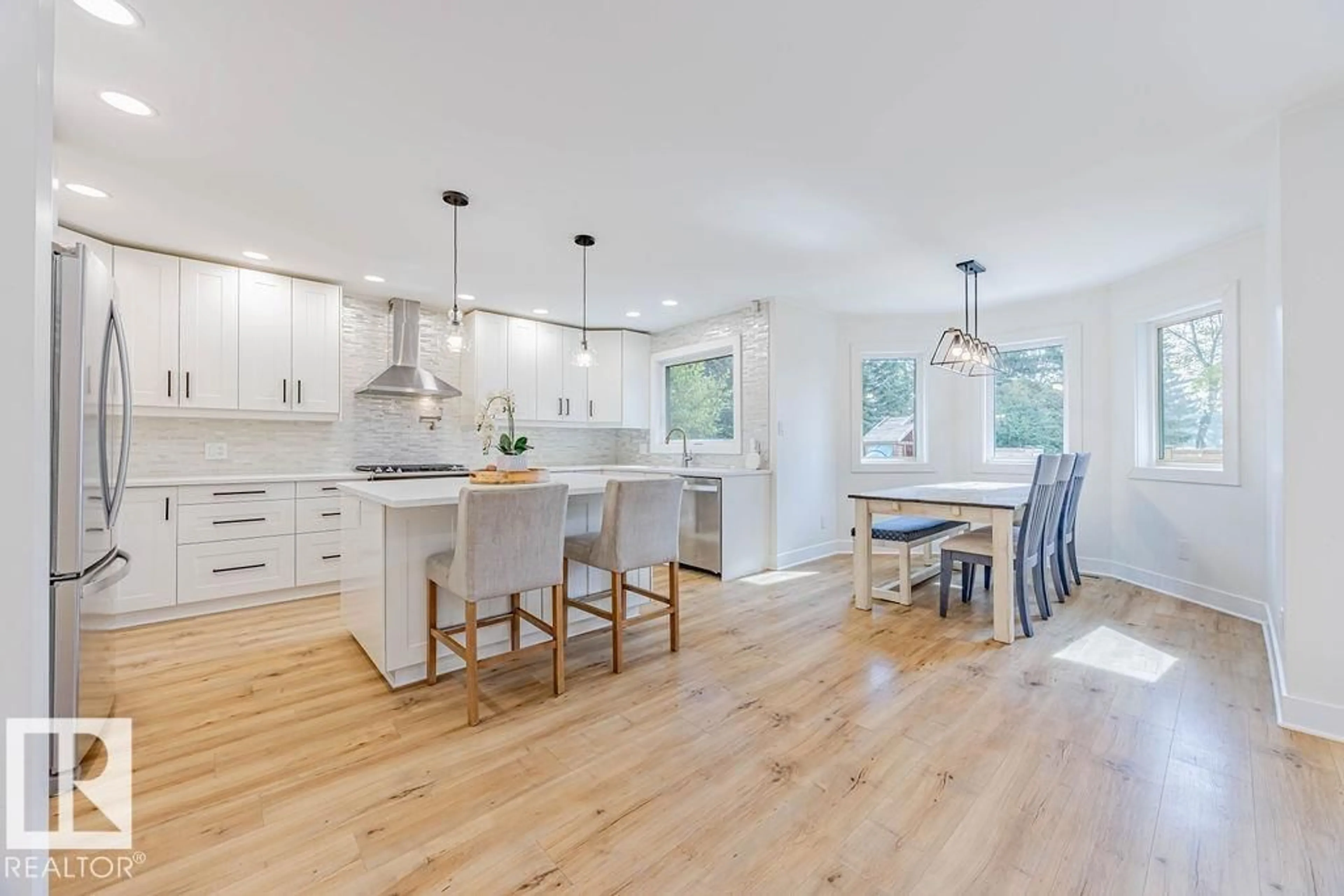 Open concept kitchen, wood/laminate floor for 107 WEBER CL, Edmonton Alberta T6M2H1