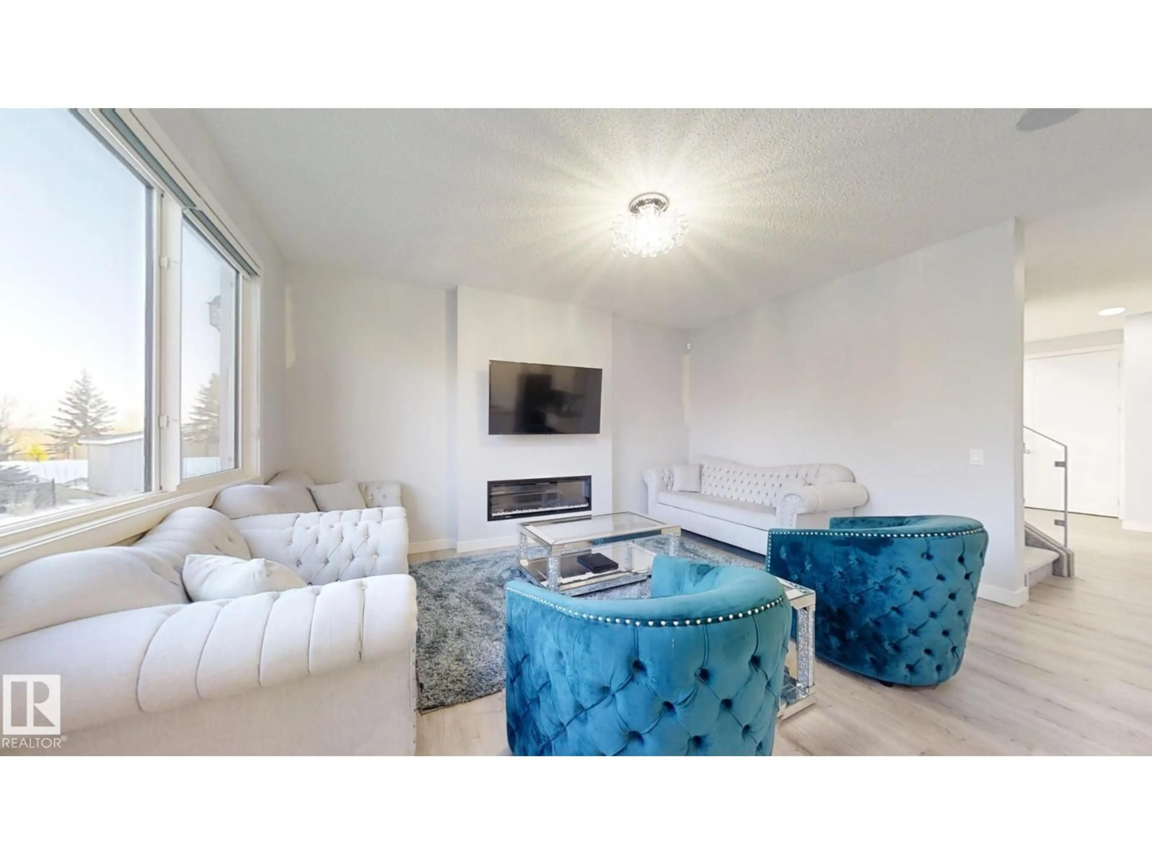 Living room with furniture, unknown for 215 GLENRIDDING RAVINE RD, Edmonton Alberta T6W5C2