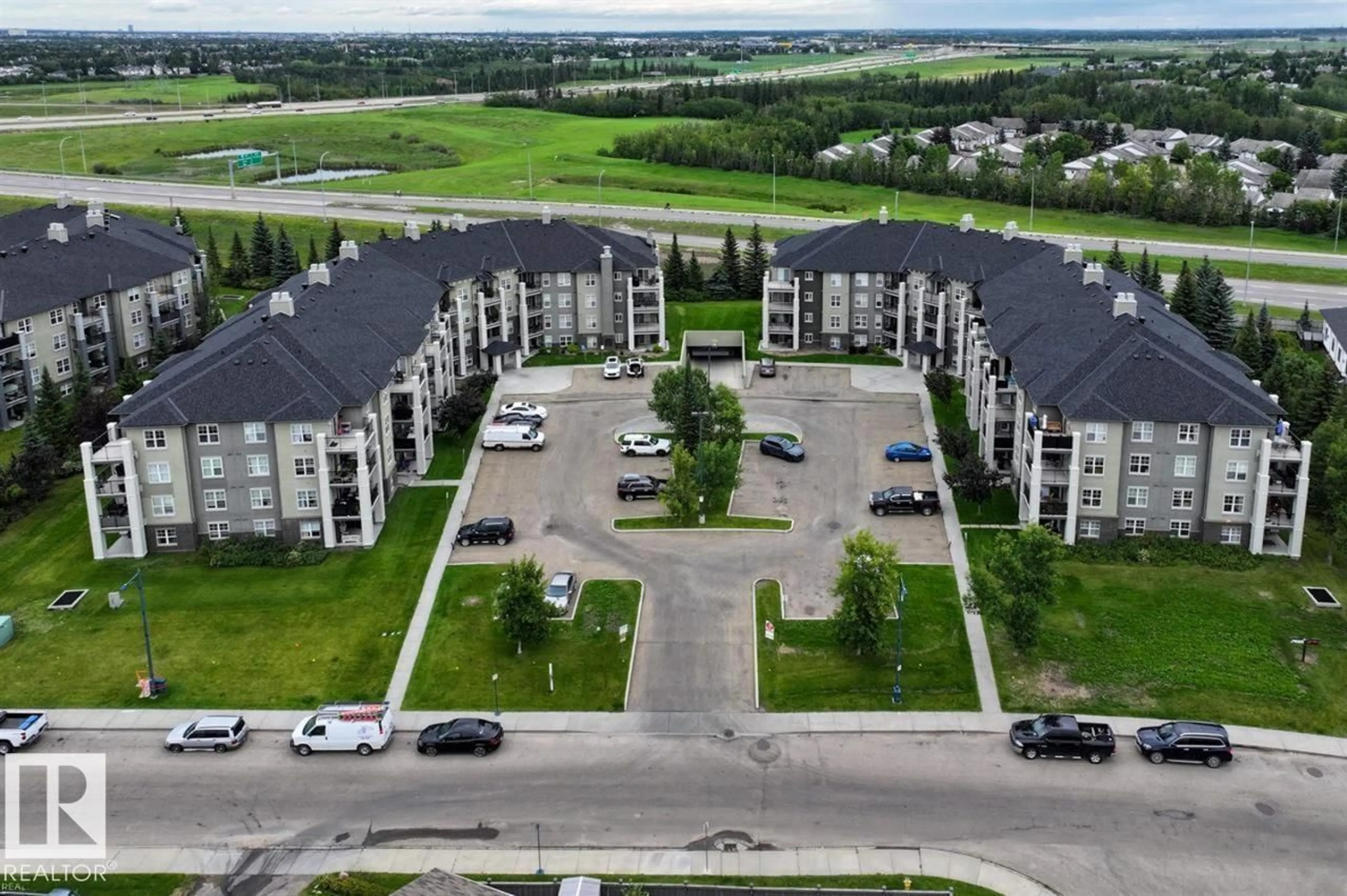 A pic from outside/outdoor area/front of a property/back of a property/a pic from drone, unknown for #307 - 622 MCALLISTER LO, Edmonton Alberta T6W1N2