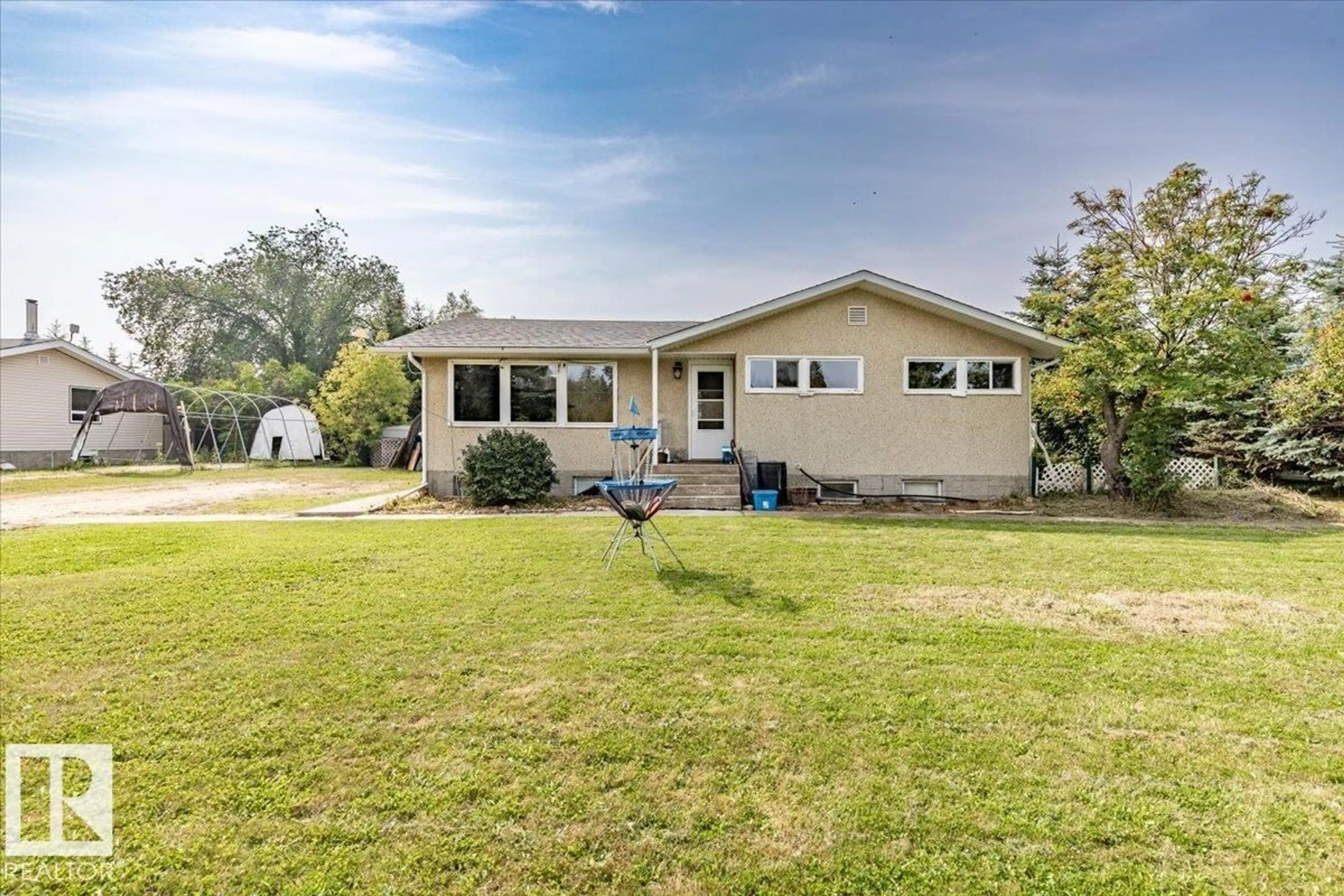 A pic from outside/outdoor area/front of a property/back of a property/a pic from drone, water/lake/river/ocean view for 291 HWY 13, Rural Wetaskiwin County Alberta T0C1H0
