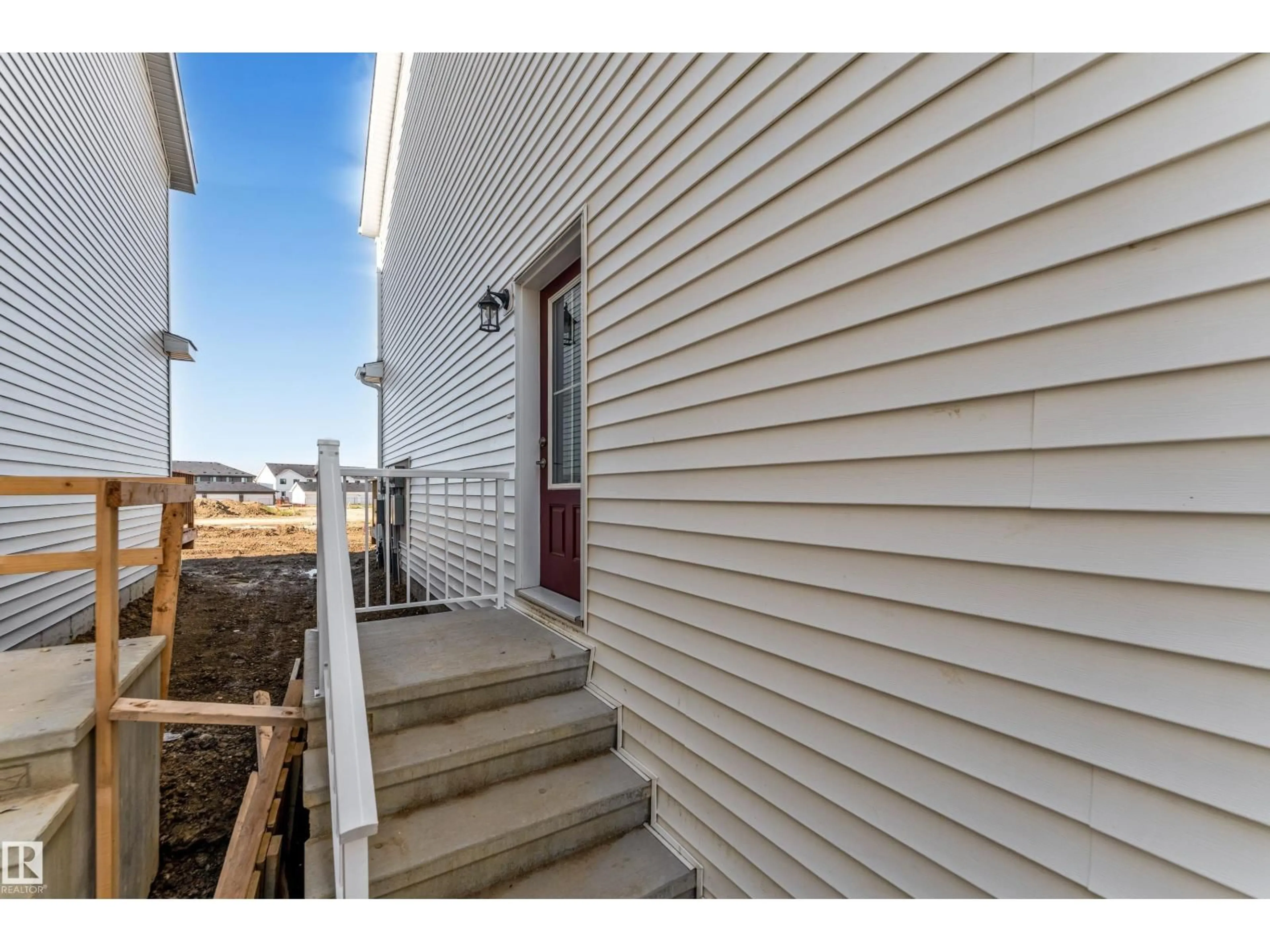 Home with vinyl exterior material, street for 4 - 7110 KESWICK CM, Edmonton Alberta T6W5P7
