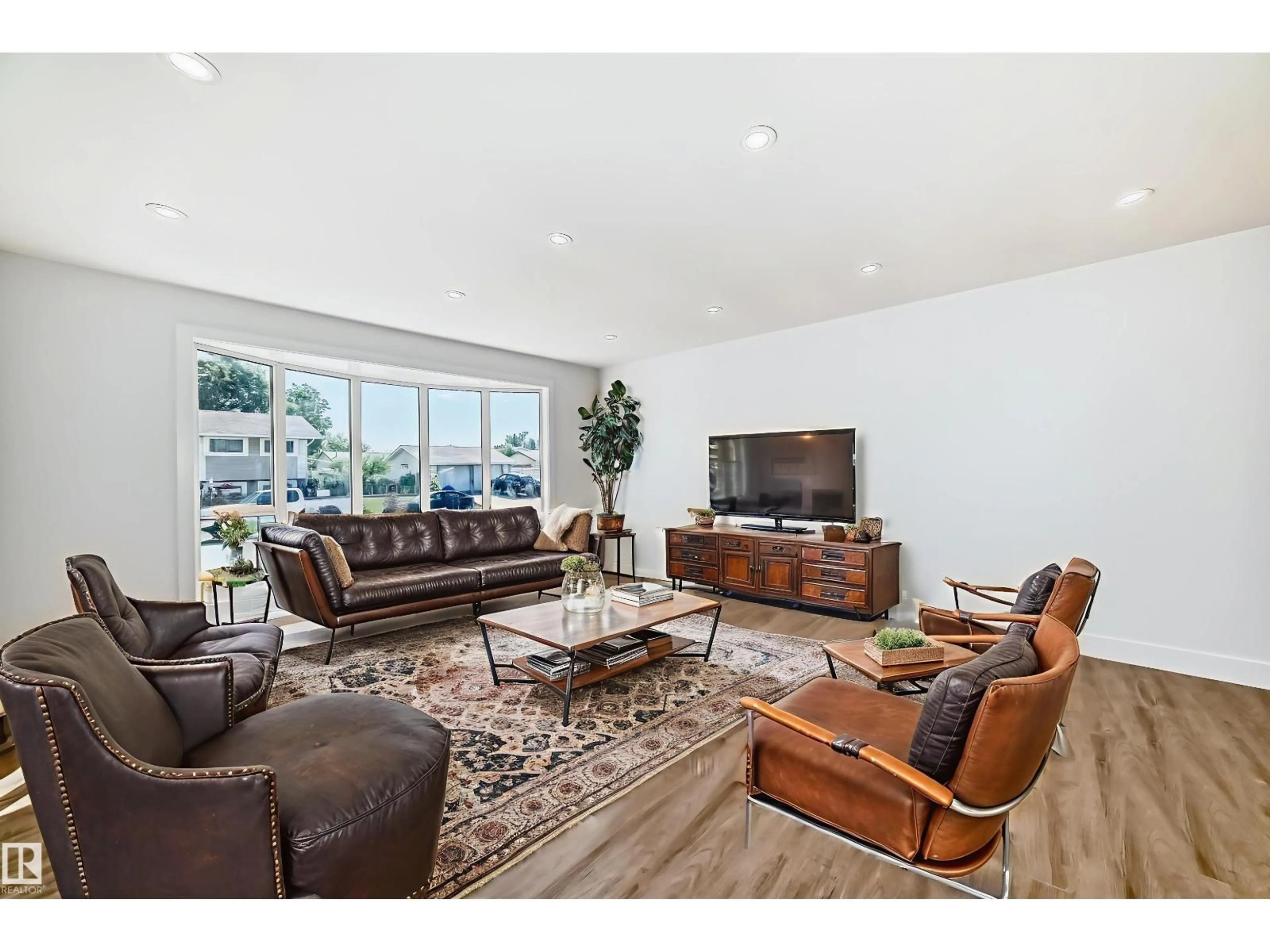 Living room with furniture, wood/laminate floor for 15016 88 ST, Edmonton Alberta T5E5T5