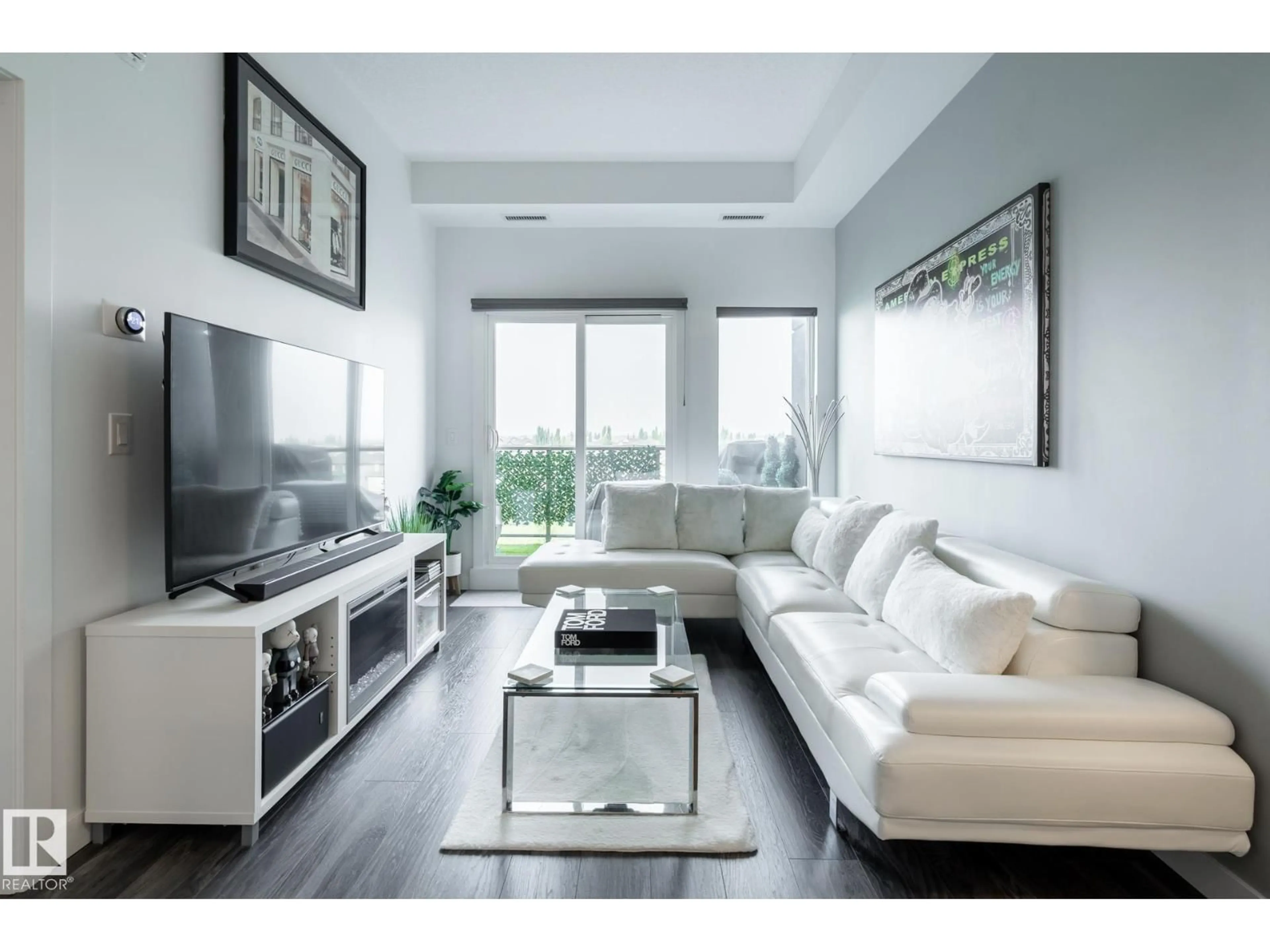 Living room with furniture, wood/laminate floor for 505 - 1316 WINDERMERE WY, Edmonton Alberta T6W2J3