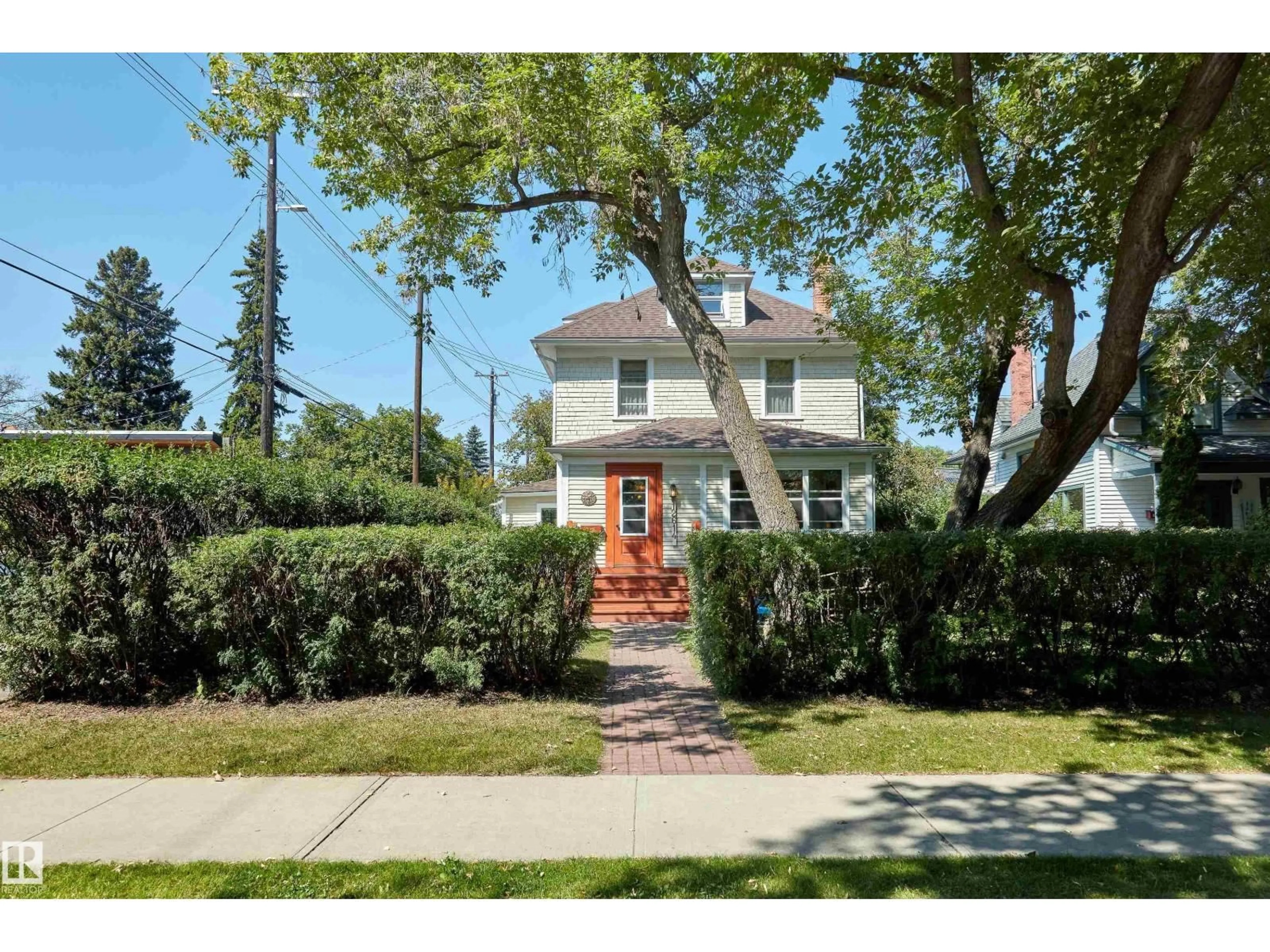 Home with brick exterior material, street for 12614 106 AV, Edmonton Alberta T5N0Z7