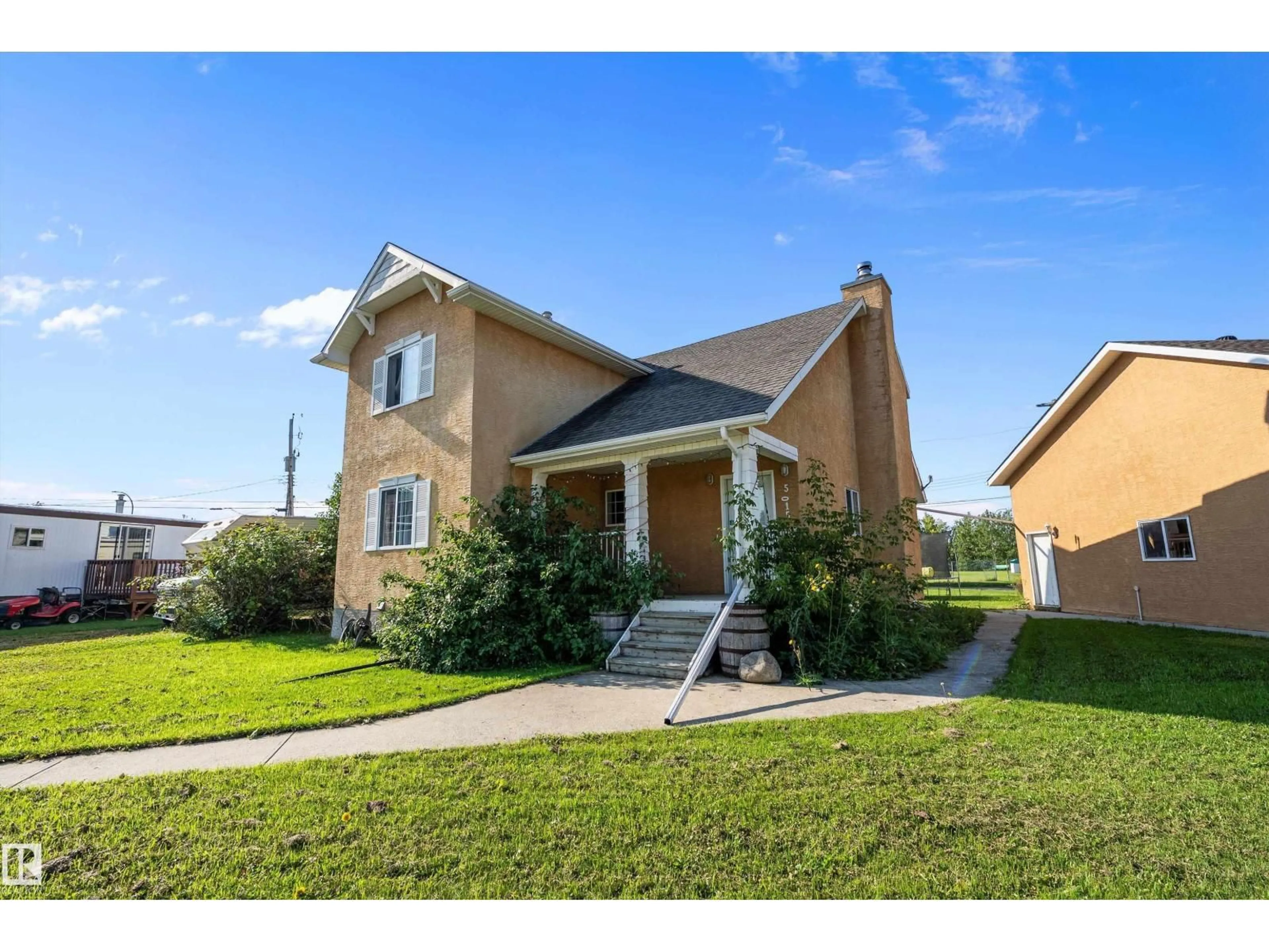 Home with vinyl exterior material, street for 5015 47 AV, Evansburg Alberta T0E0T0