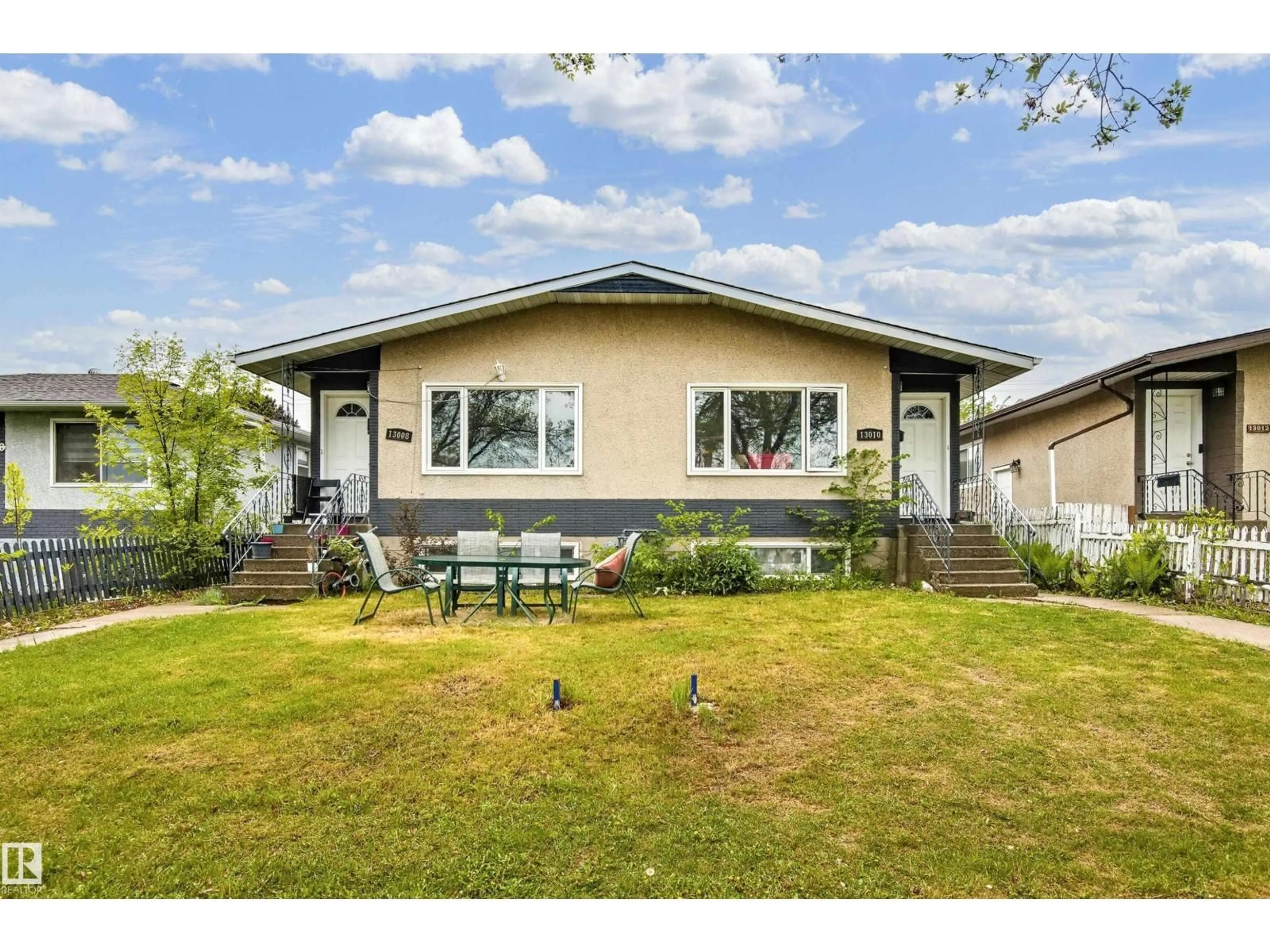 Home with vinyl exterior material, street for 13008-13010 102 ST NW, Edmonton Alberta T6H4B2