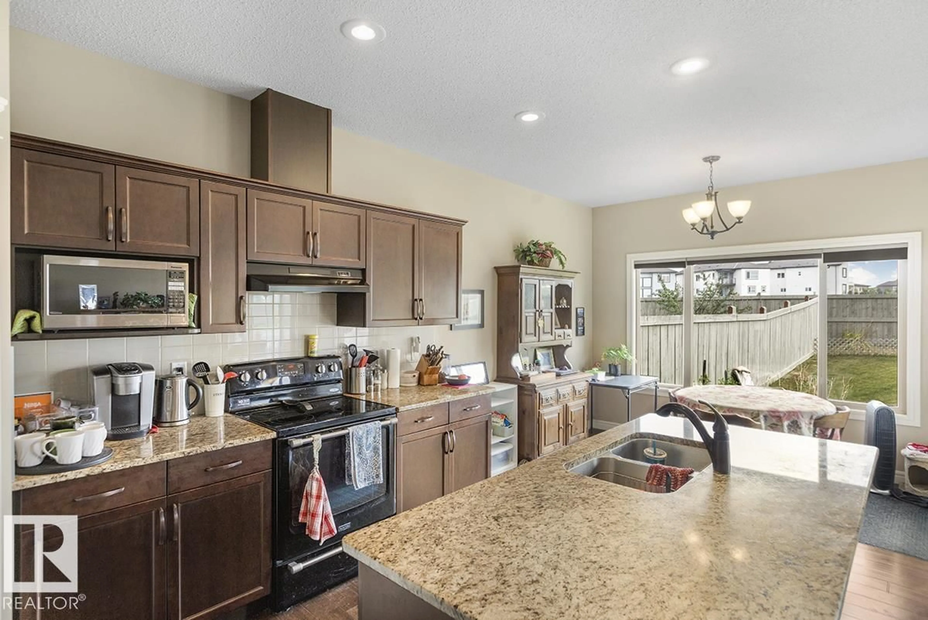Open concept kitchen, ceramic/tile floor for 2807 16 AV, Edmonton Alberta T6T0K2
