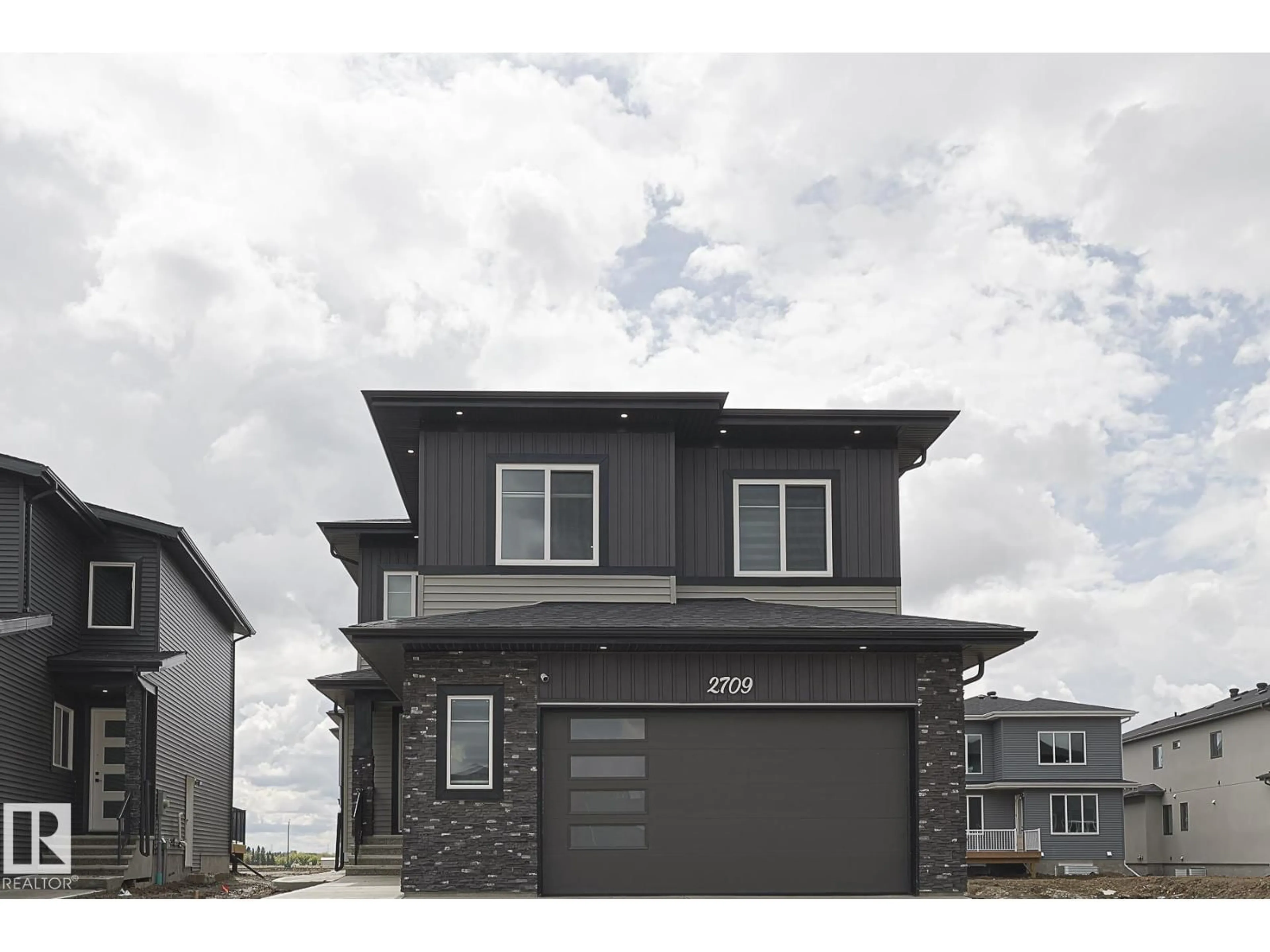Home with vinyl exterior material, street for 2709 62 AVE, Rural Leduc County Alberta T4X3A5
