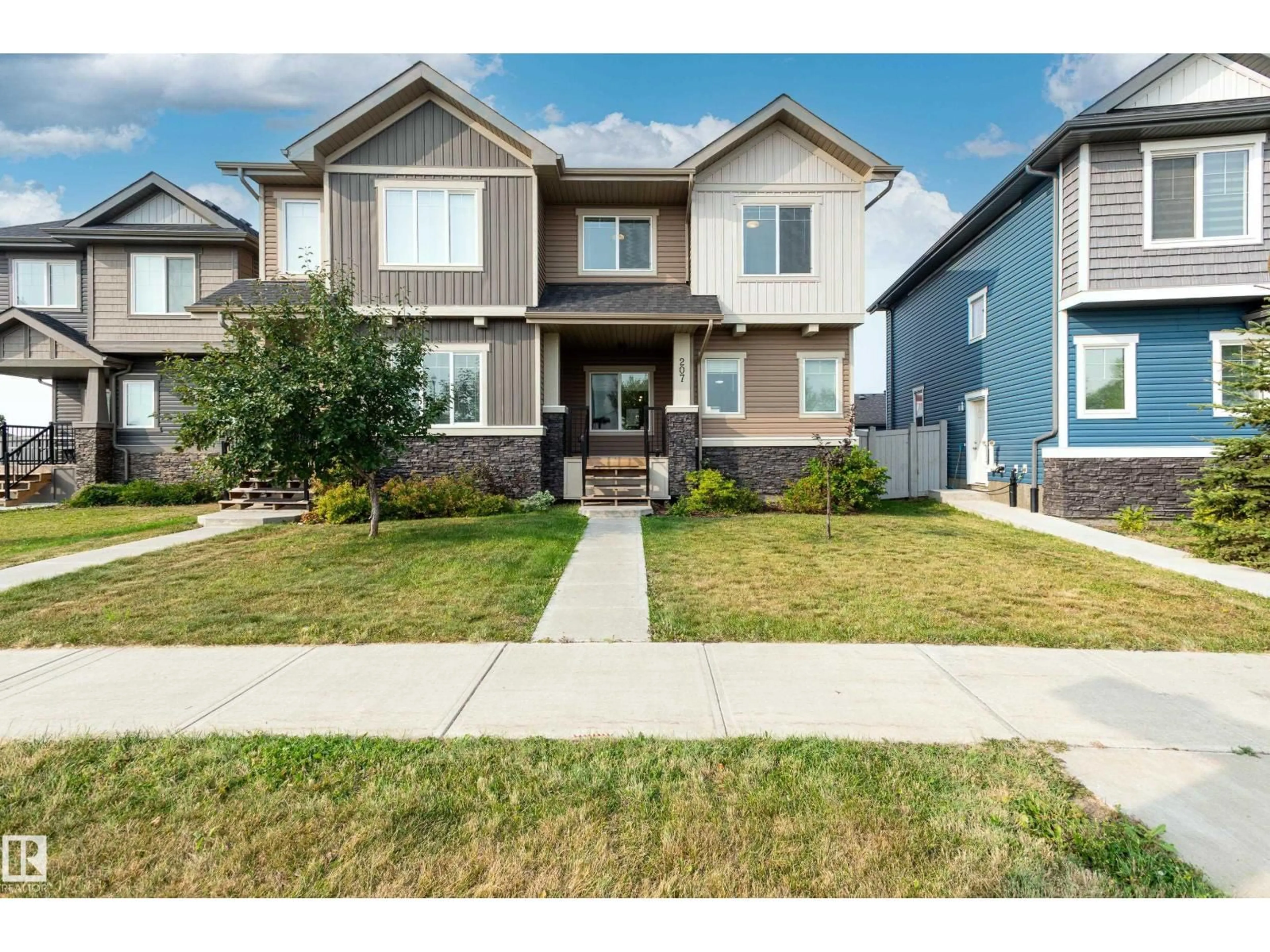 Home with vinyl exterior material, street for 207 GRIESBACH RD, Edmonton Alberta T5E6S5