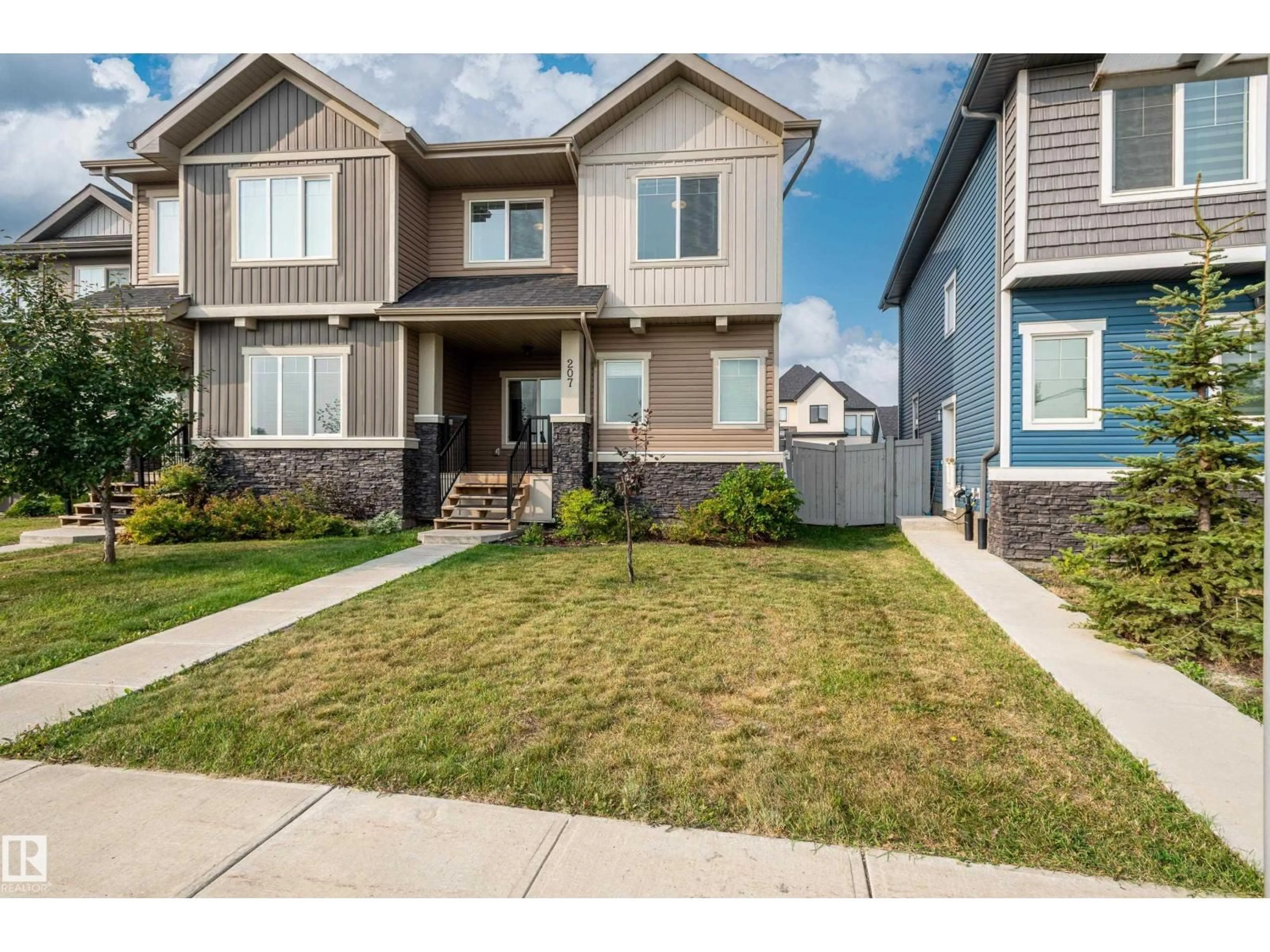 Home with vinyl exterior material, street for 207 GRIESBACH RD, Edmonton Alberta T5E6S5