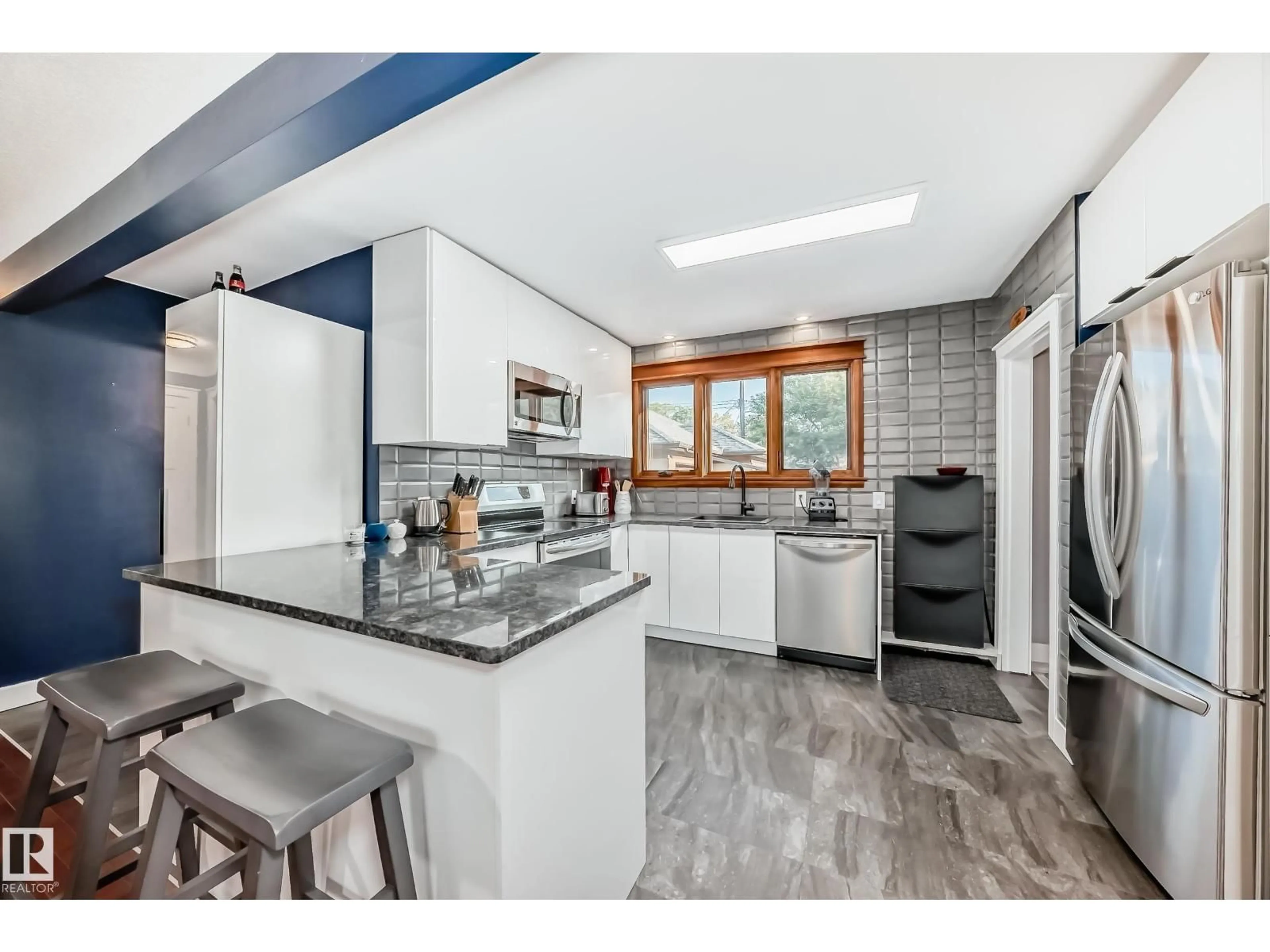 Open concept kitchen, unknown for 7712 86 AV, Edmonton Alberta T6C1H8