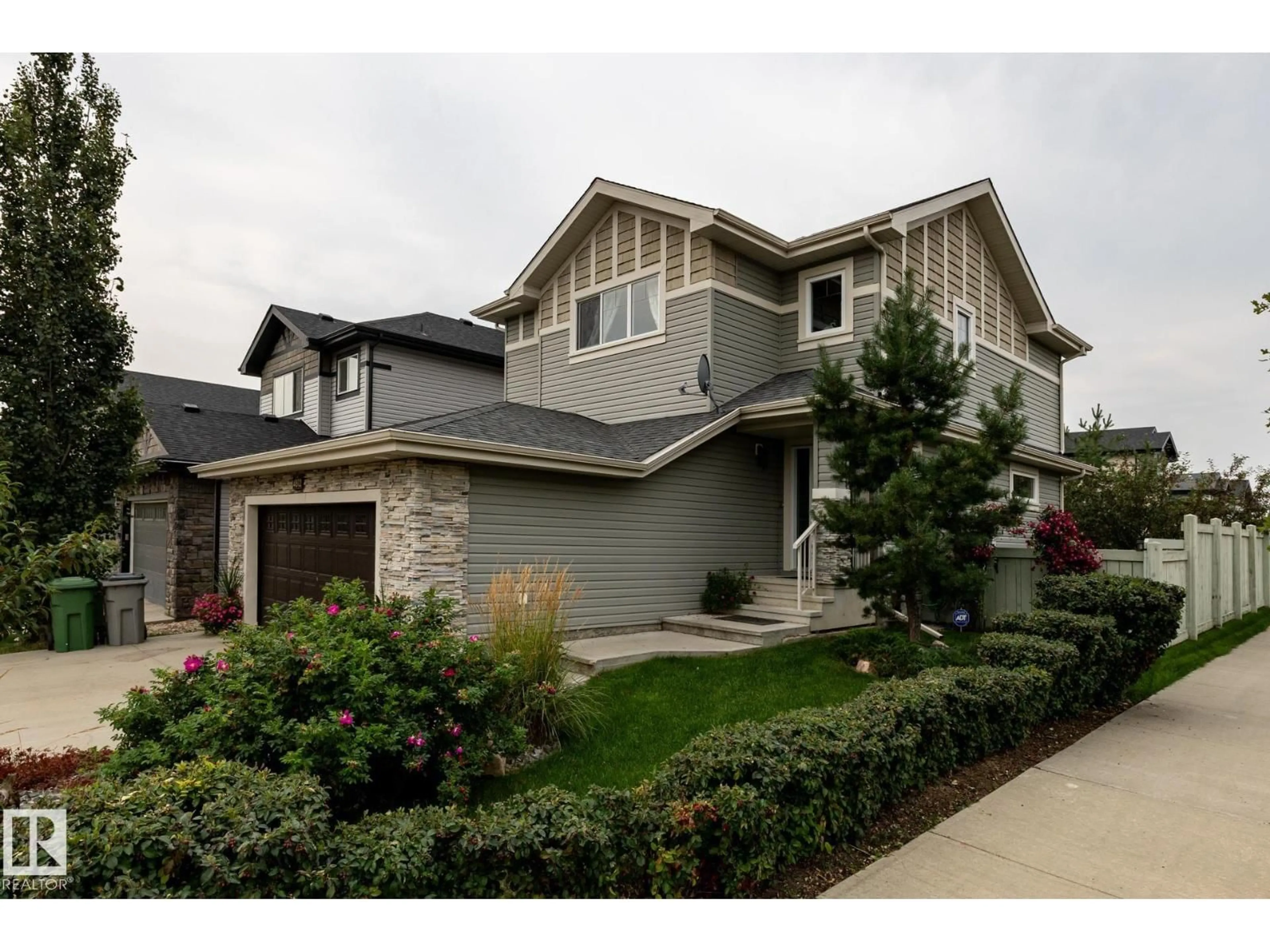 Home with vinyl exterior material, street for 4812 39 ST, Beaumont Alberta T4X1Y8