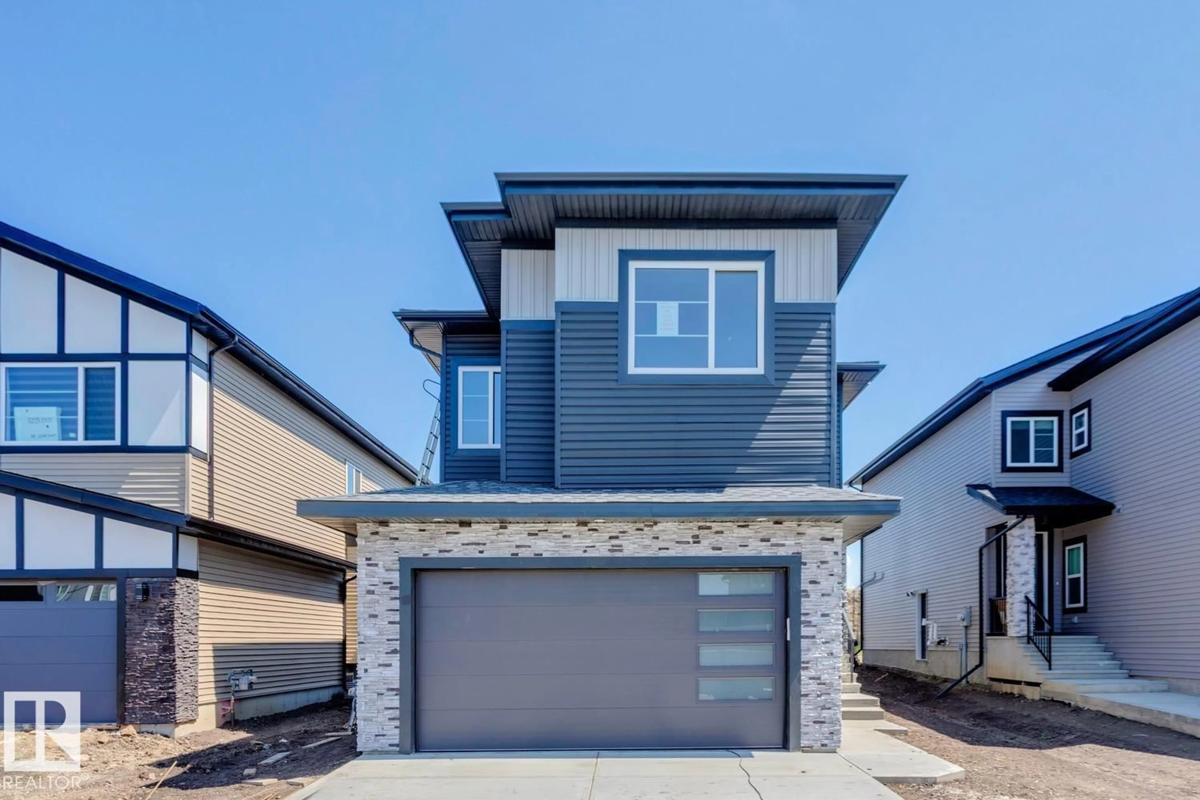 Home with vinyl exterior material, street for NE - 6221 19 ST, Rural Leduc County Alberta T4X3C8