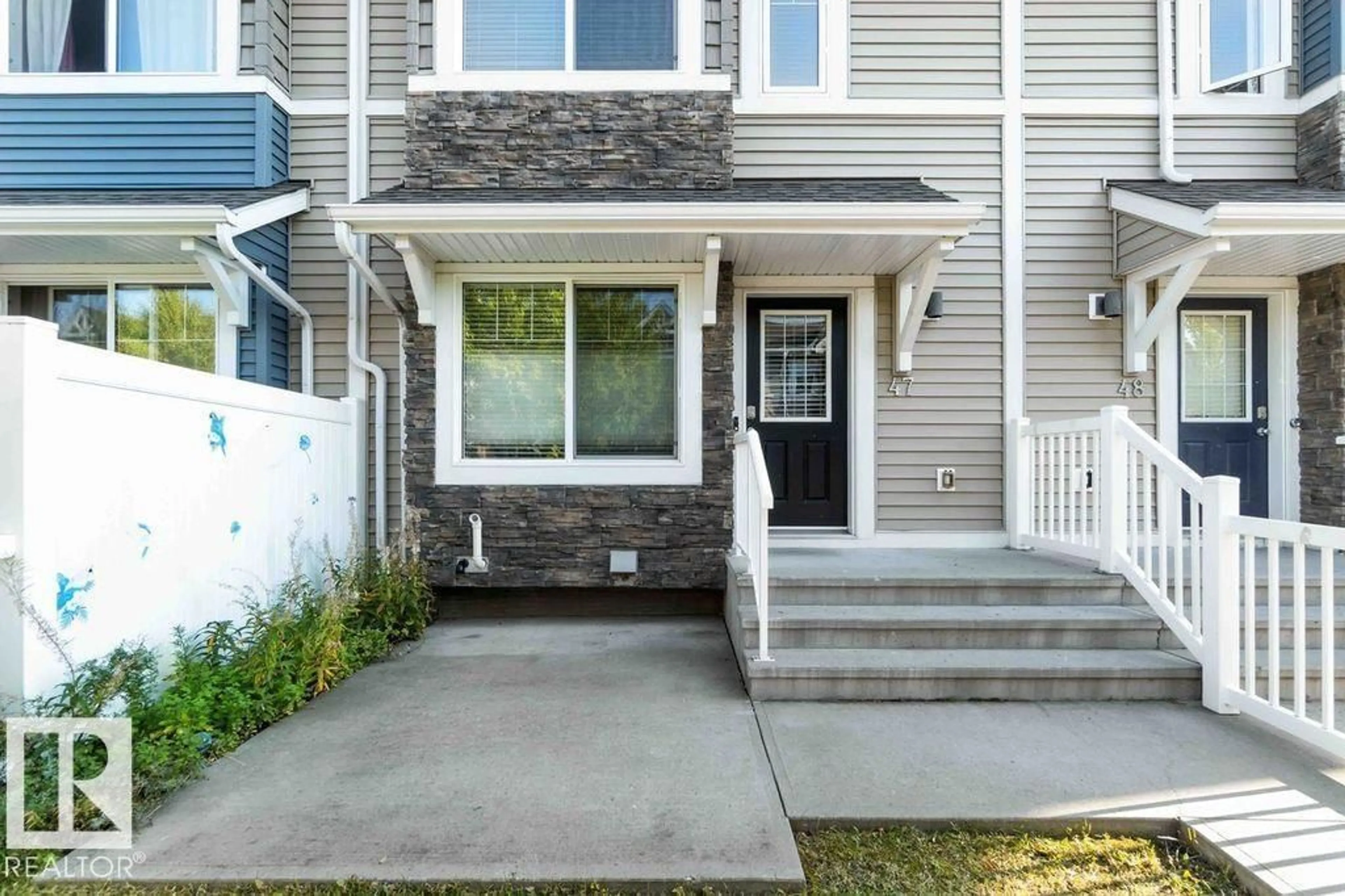 Home with vinyl exterior material, street for #47 - 415 CLAREVIEW RD, Edmonton Alberta T5A0Z6