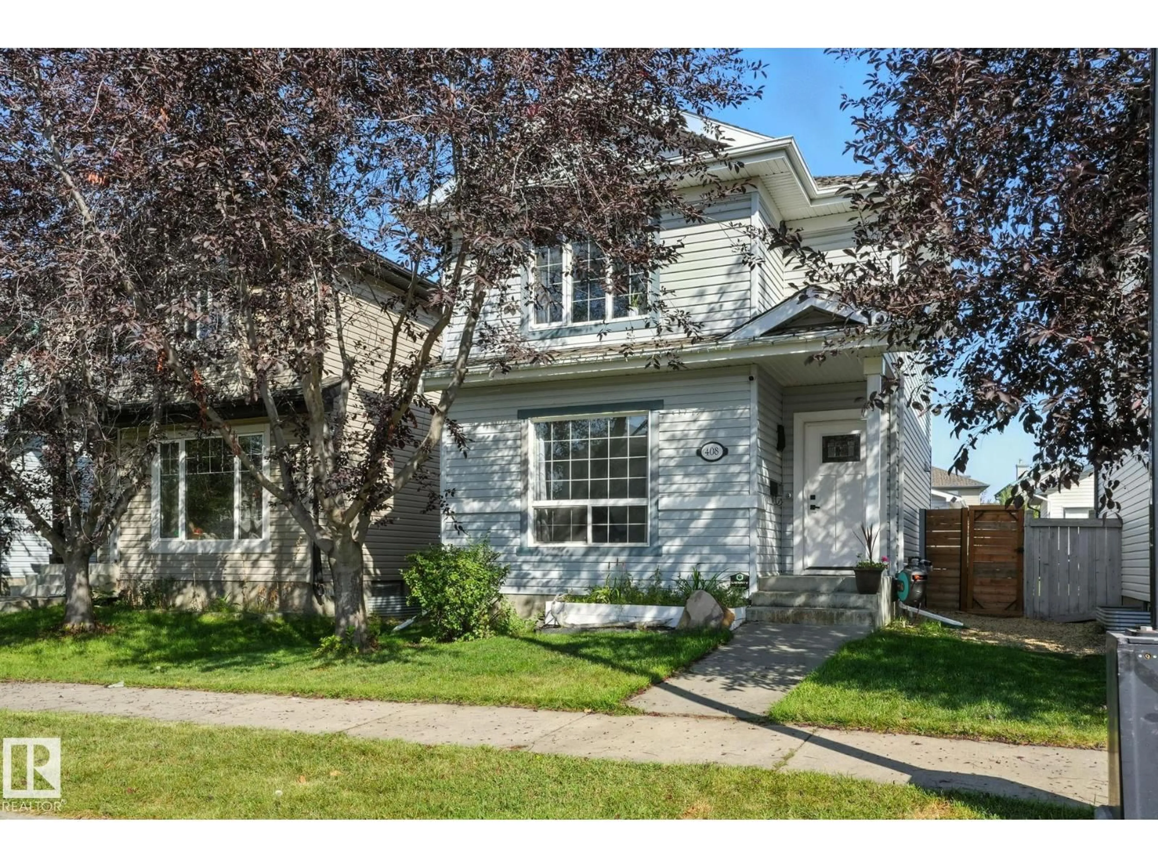 Home with vinyl exterior material, street for NW NW - 408 GIBB WD, Edmonton Alberta T5T6W8
