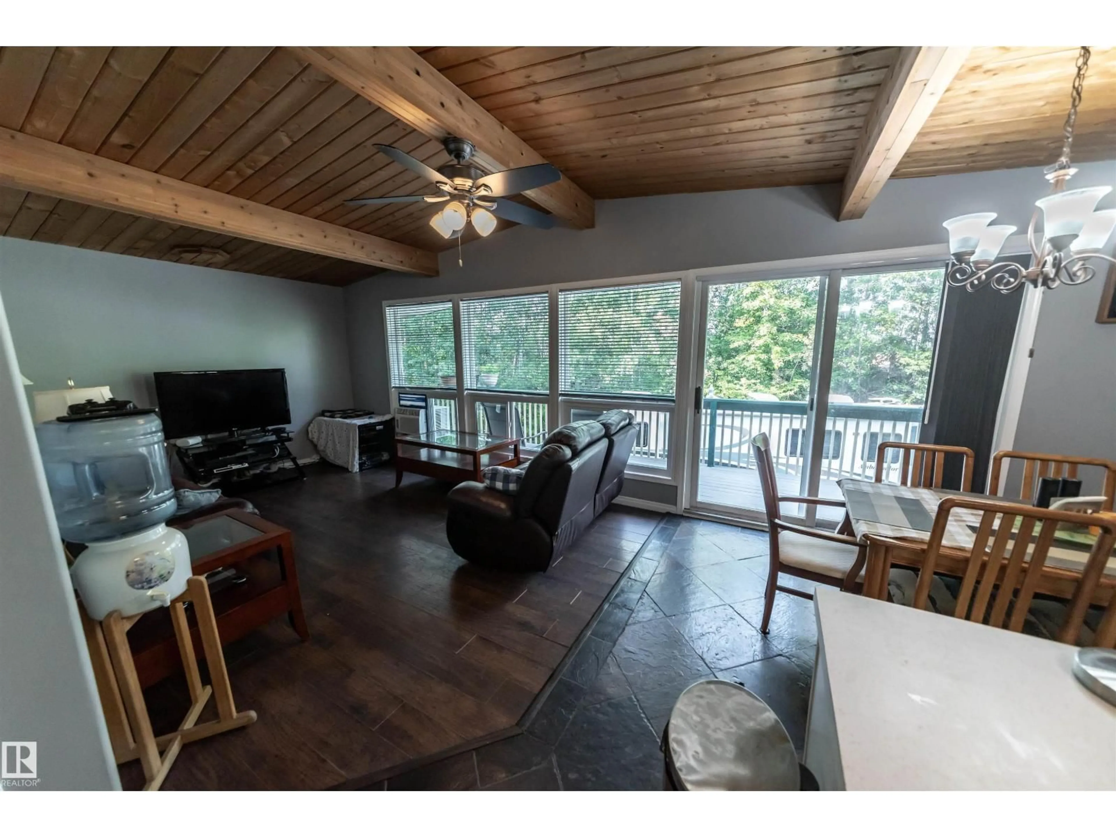 Living room with furniture, wood/laminate floor for 5441 49 ST, Rural Lac Ste. Anne County Alberta T0E0A0