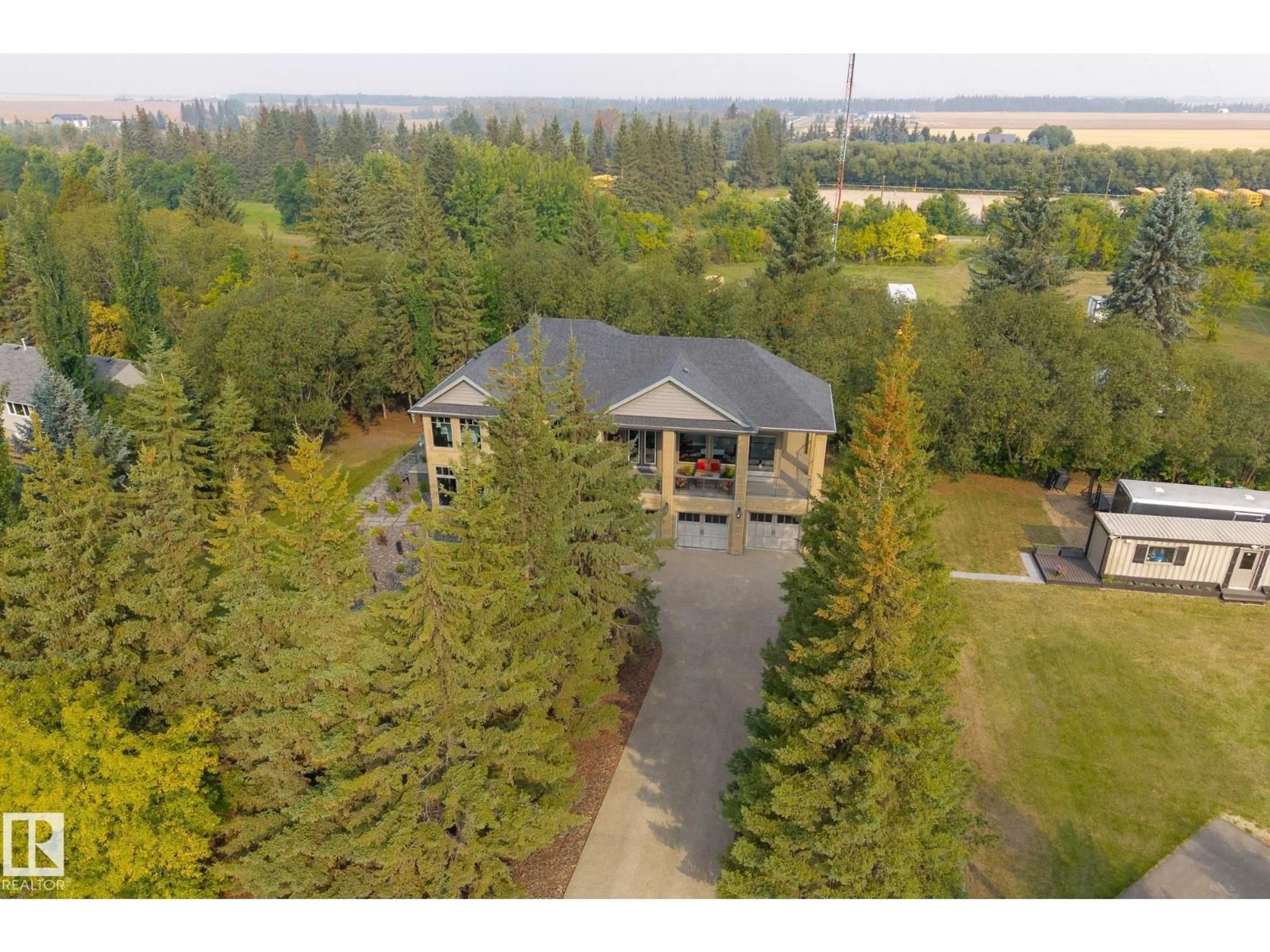 A pic from outside/outdoor area/front of a property/back of a property/a pic from drone, water/lake/river/ocean view for 26028 MEADOWVIEW DR, Rural Sturgeon County Alberta T8T0K8