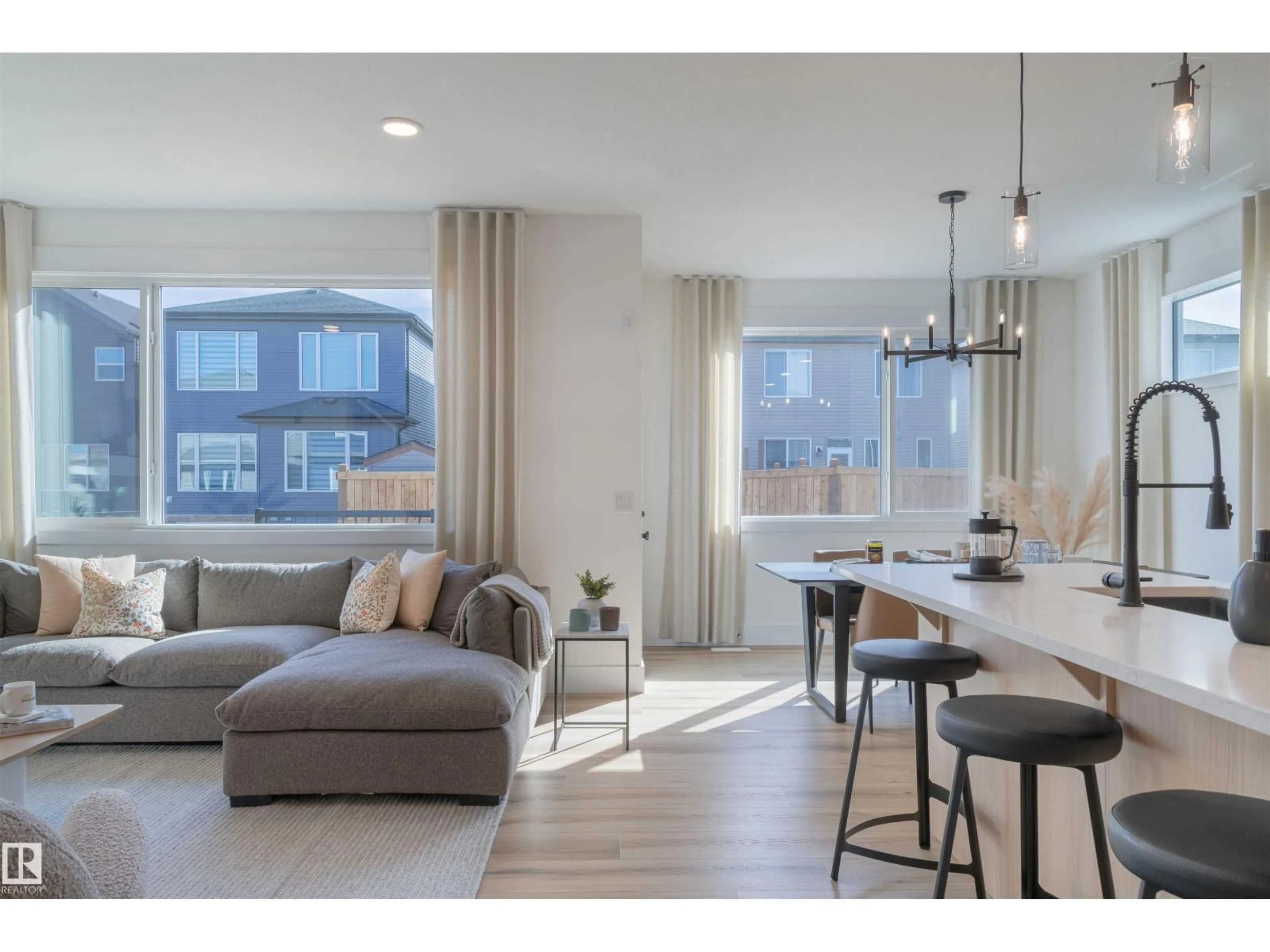 Living room with furniture, wood/laminate floor for 367 GLENRIDDING RAVINE RD, Edmonton Alberta T6W4E6