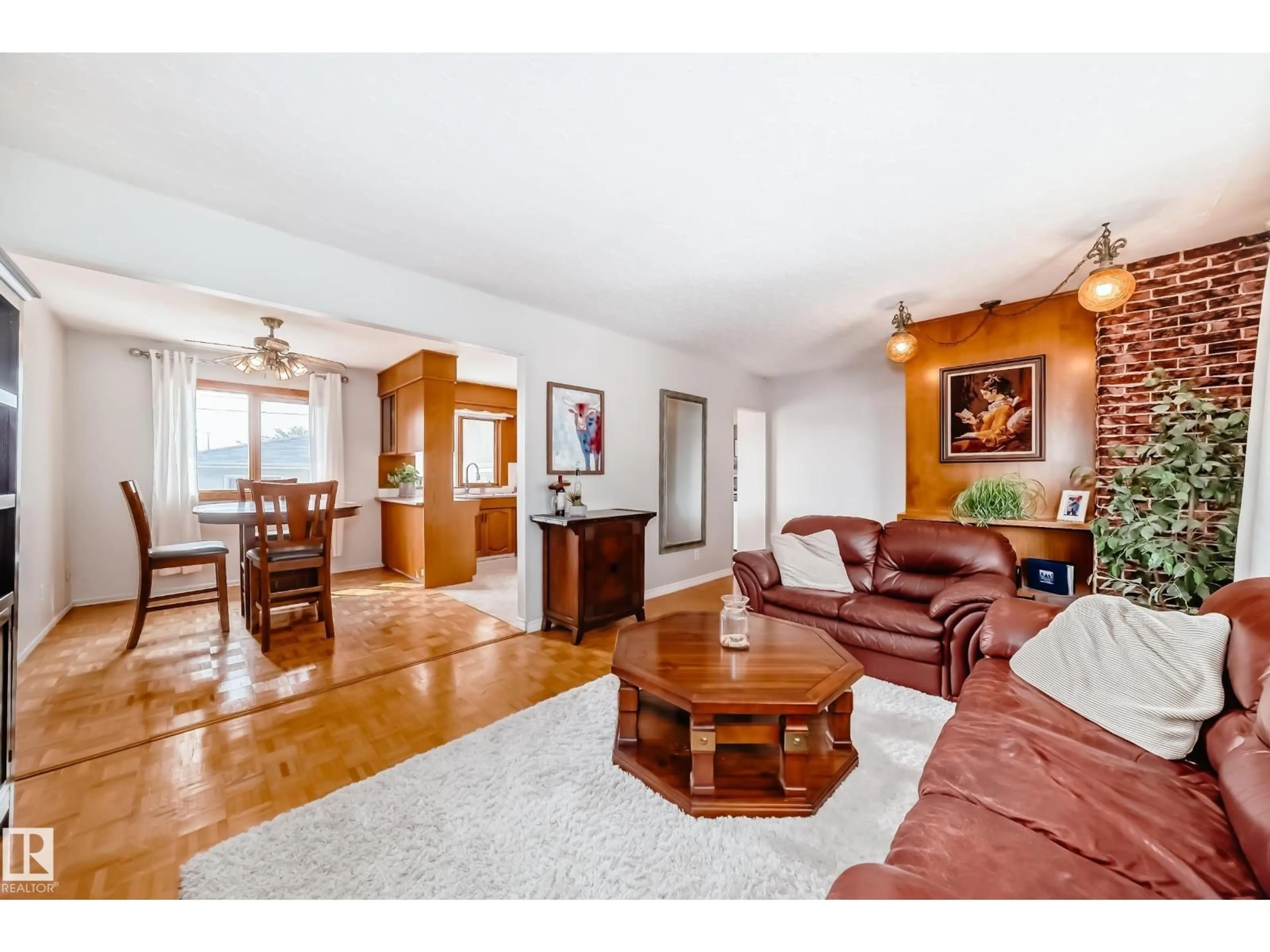 Living room with furniture, wood/laminate floor for NW - 10511 135B AV, Edmonton Alberta T5E1T7