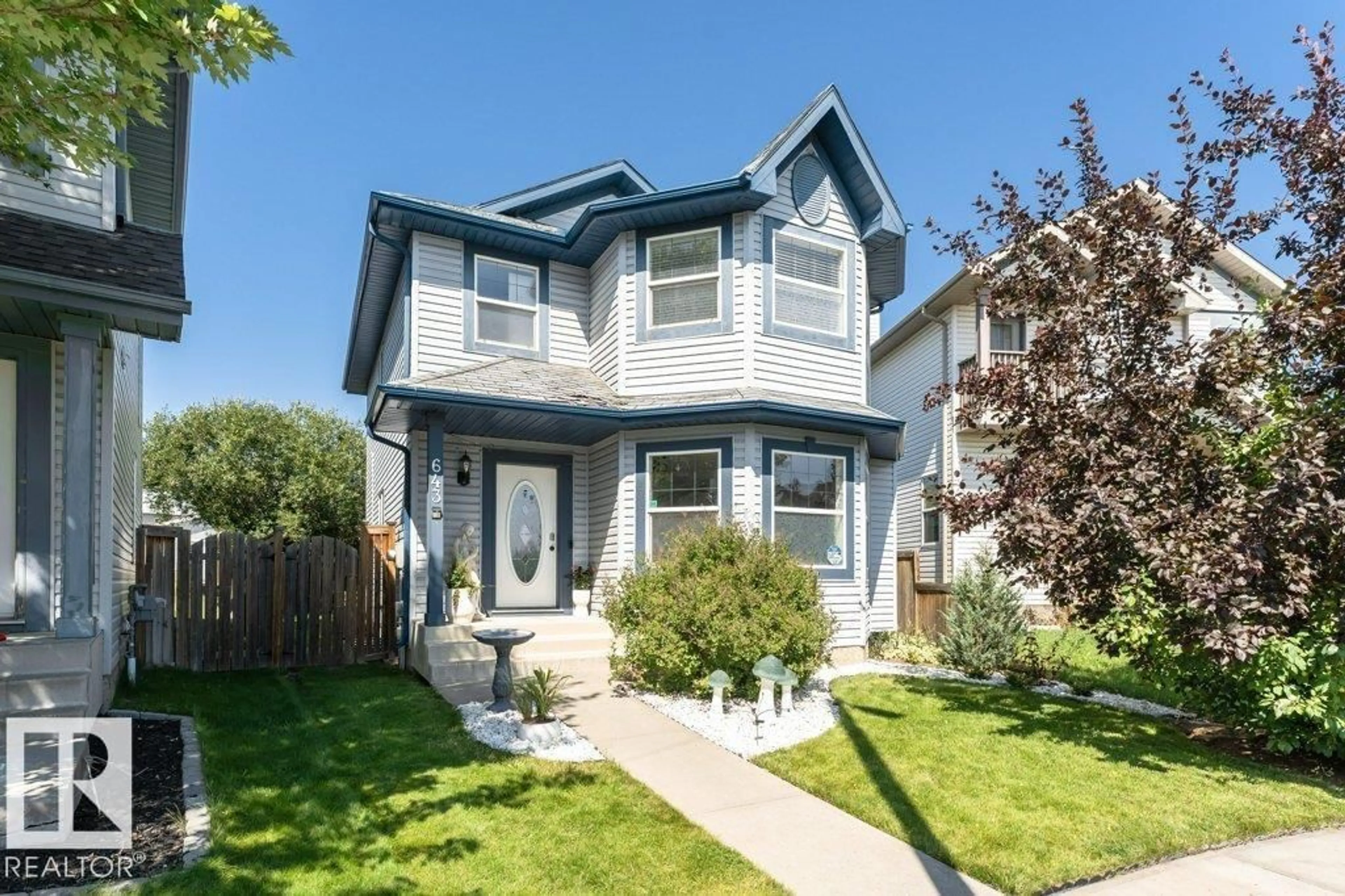 Home with vinyl exterior material, street for 643 WINDROSS CR, Edmonton Alberta T6T1Y1