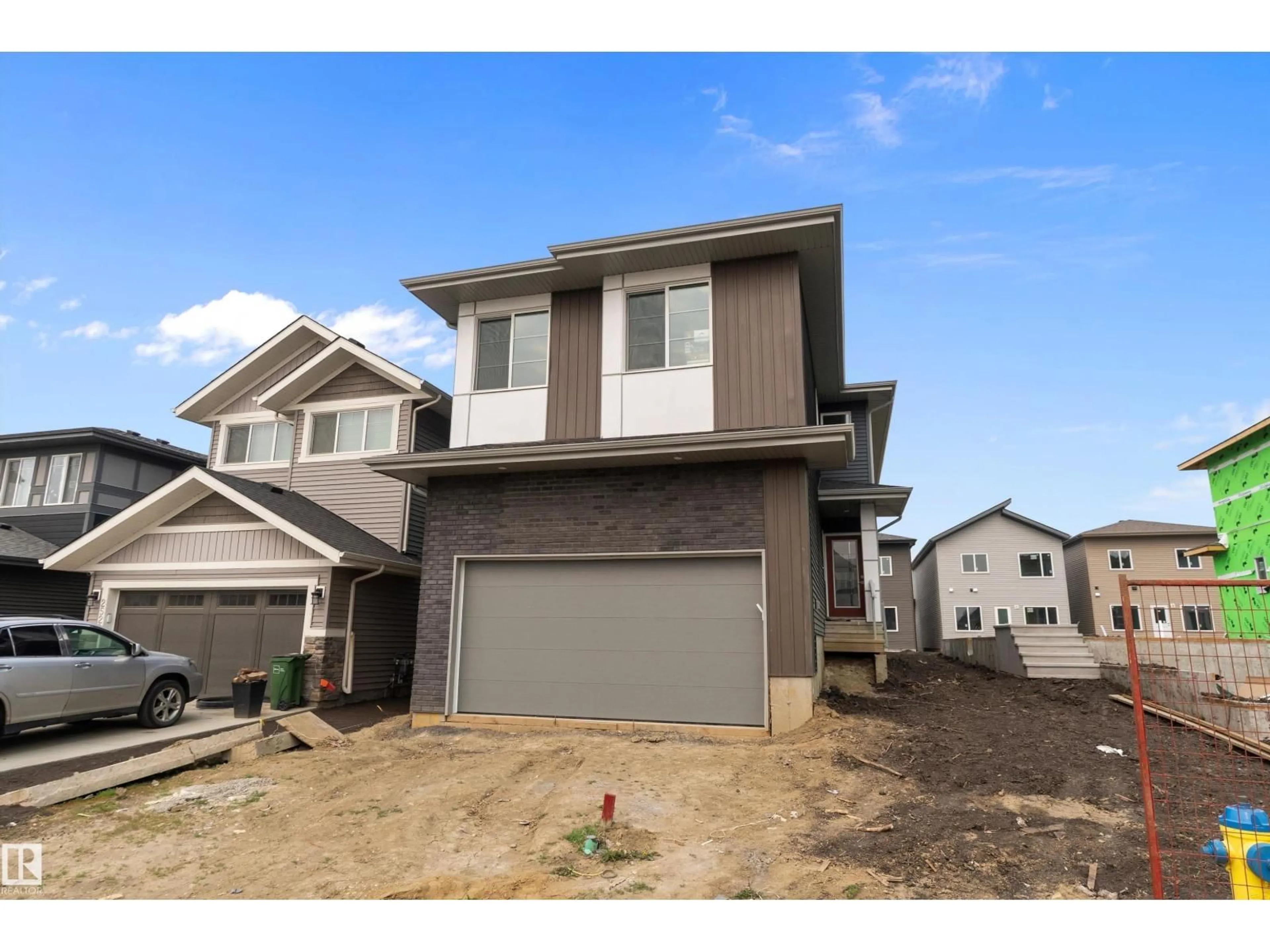 Home with vinyl exterior material, street for NW - 2532 210 ST, Edmonton Alberta T6M2M7