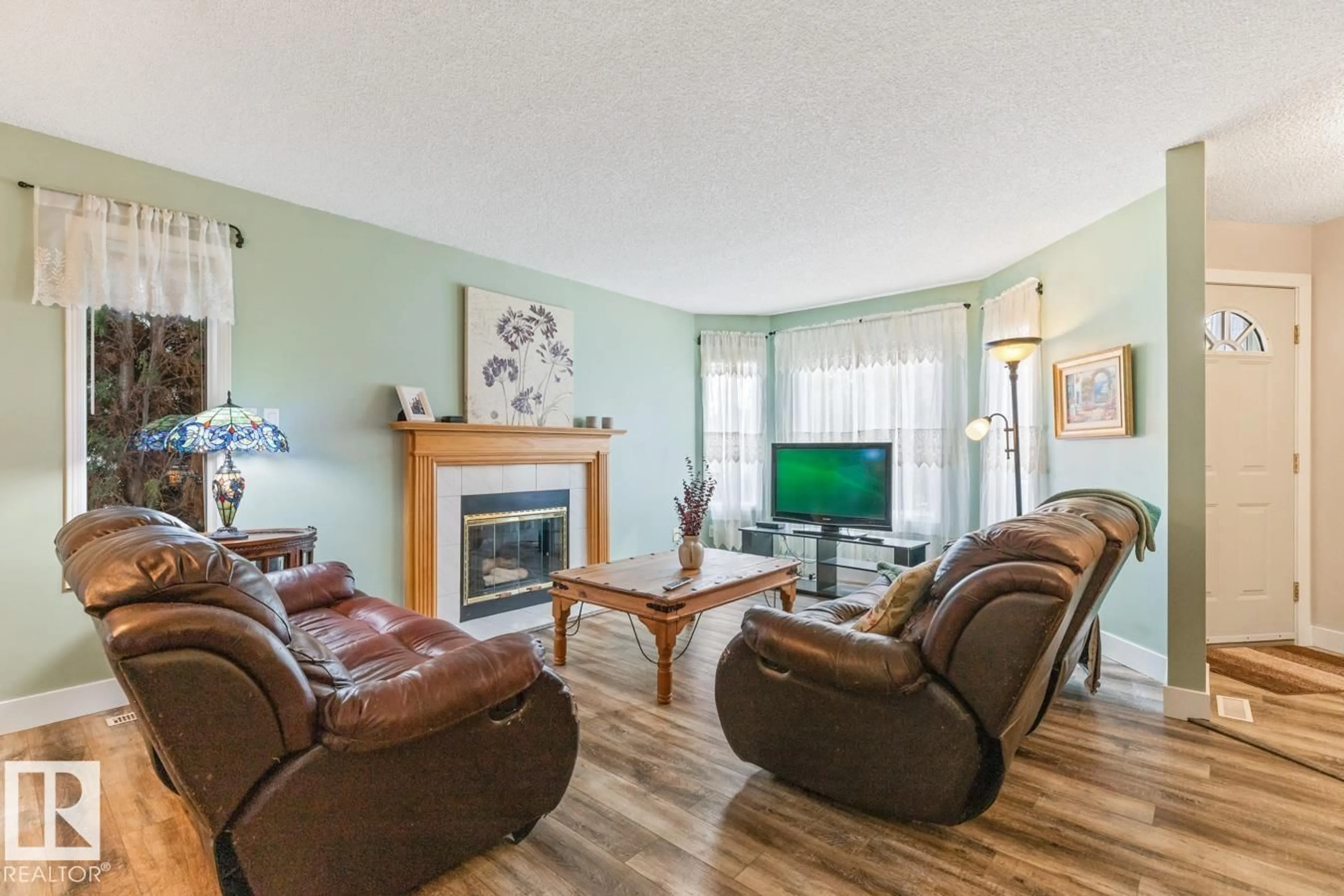 Living room with furniture, wood/laminate floor for 259 REGENCY DR, Sherwood Park Alberta T8A5P4