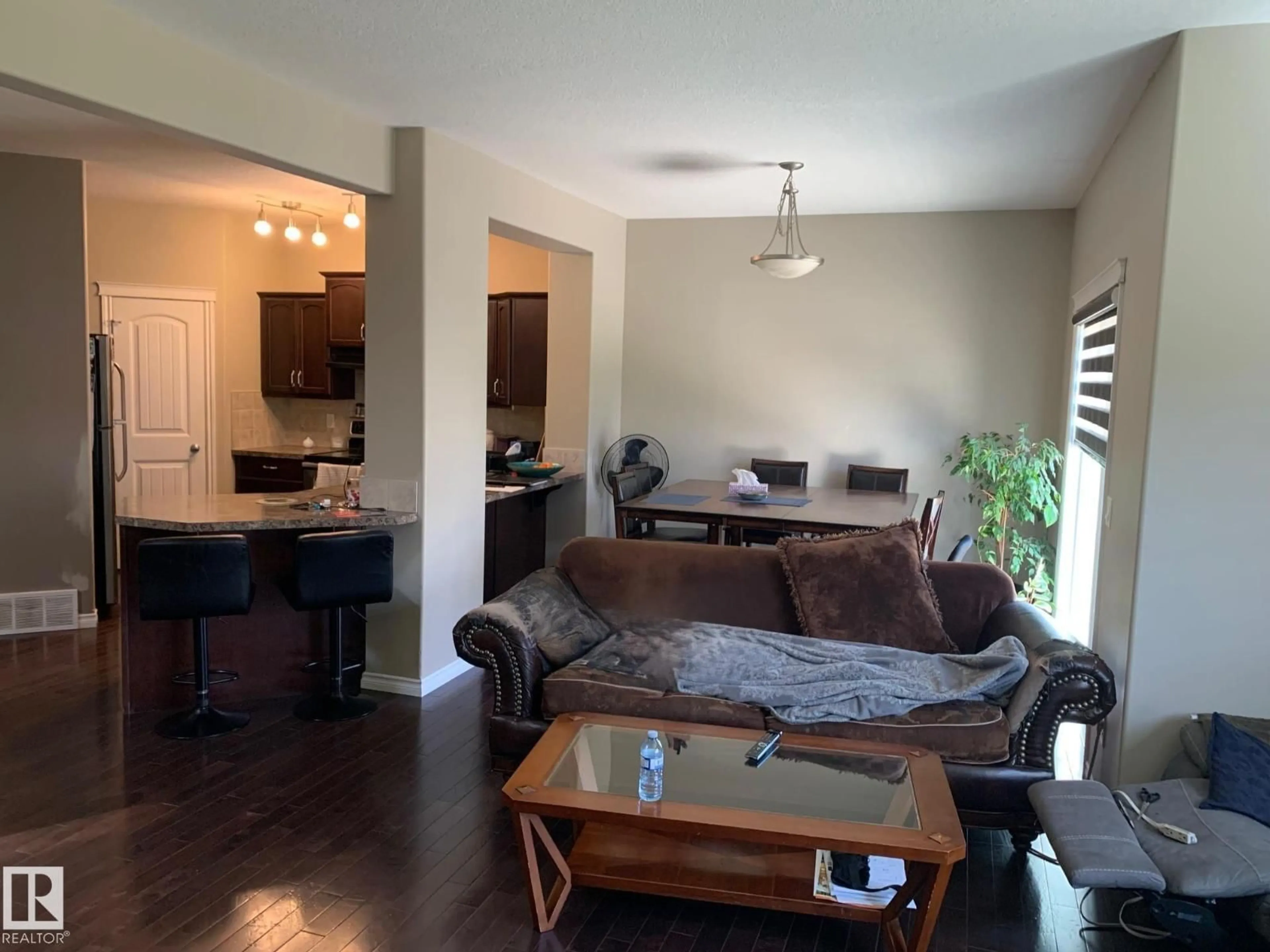 Living room with furniture, wood/laminate floor for SW - 1741 63A ST, Edmonton Alberta T6X0S1