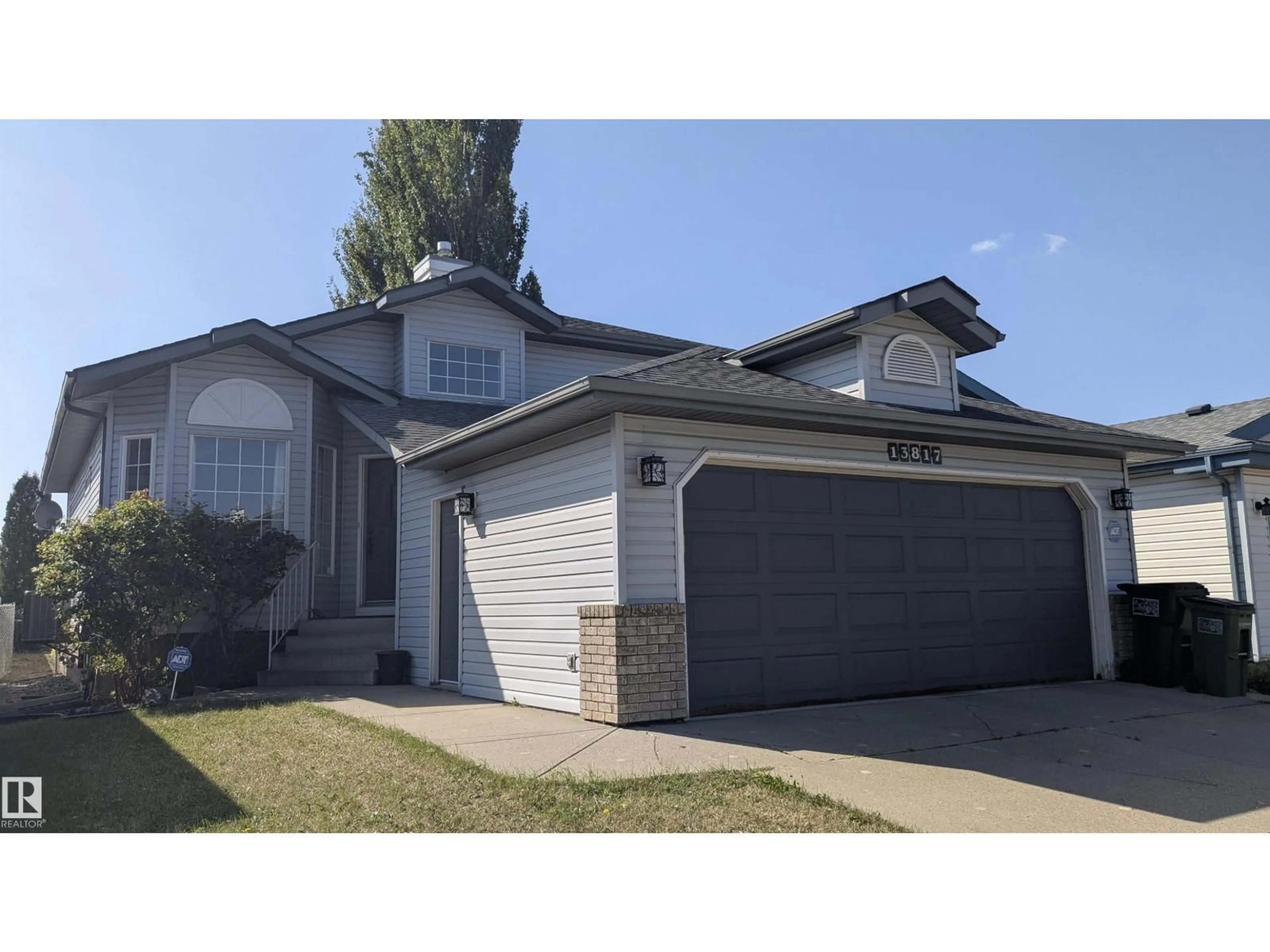 Home with vinyl exterior material, street for 13817 131A AV NW, Edmonton Alberta T5L5A7