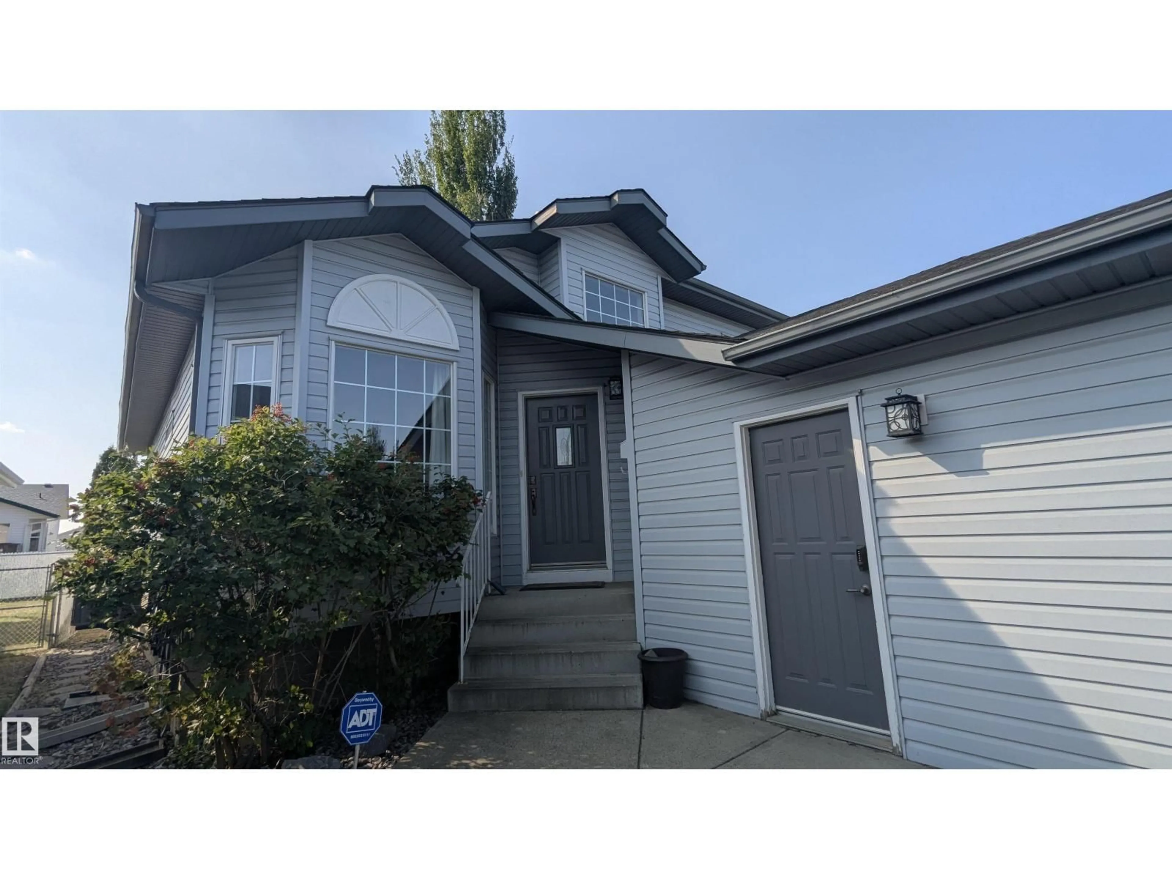 Home with vinyl exterior material, street for 13817 131A AV NW, Edmonton Alberta T5L5A7