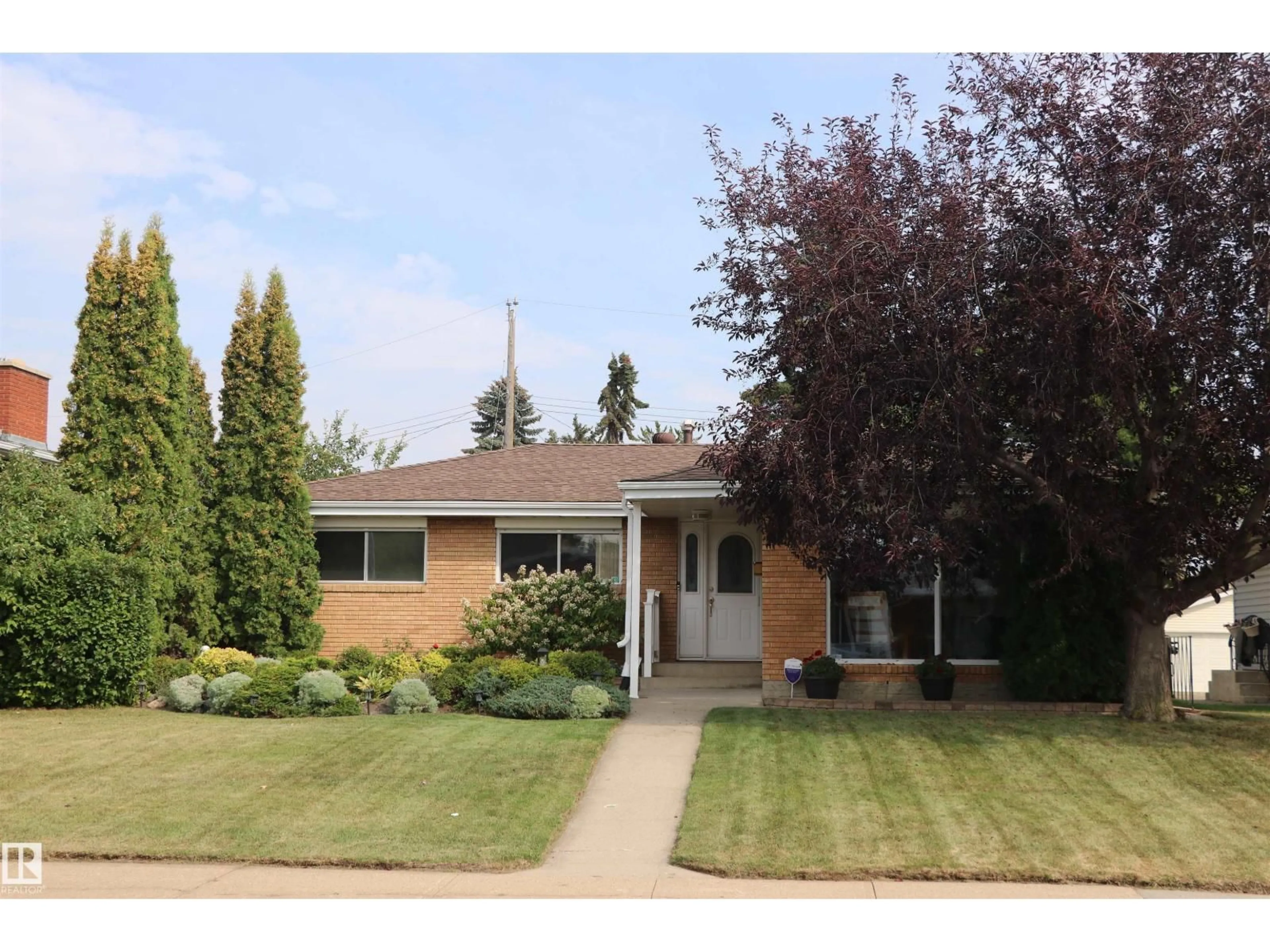 Home with vinyl exterior material, street for NW - 8707 56 ST, Edmonton Alberta T6B1H8