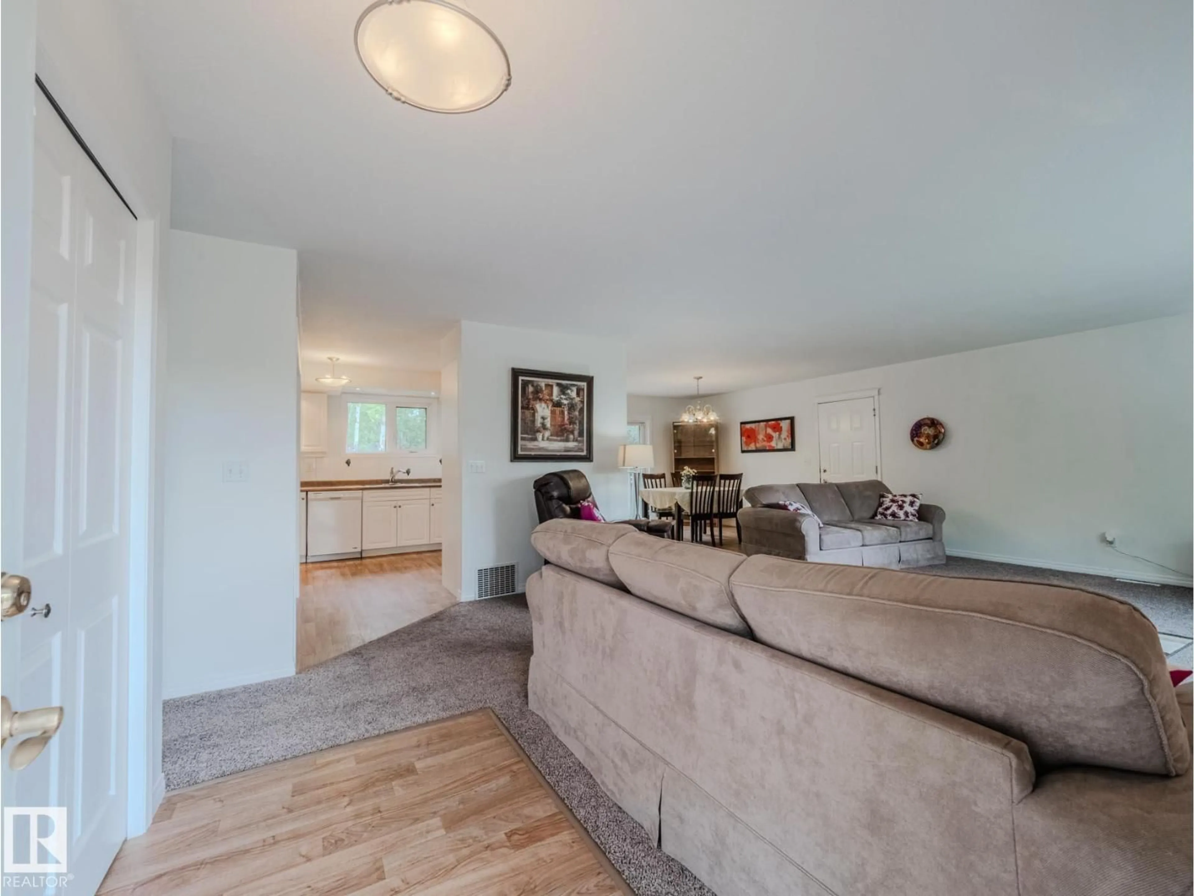 Living room with furniture, wood/laminate floor for 266 52122 RGE ROAD 210, Rural Strathcona County Alberta T8G1A4