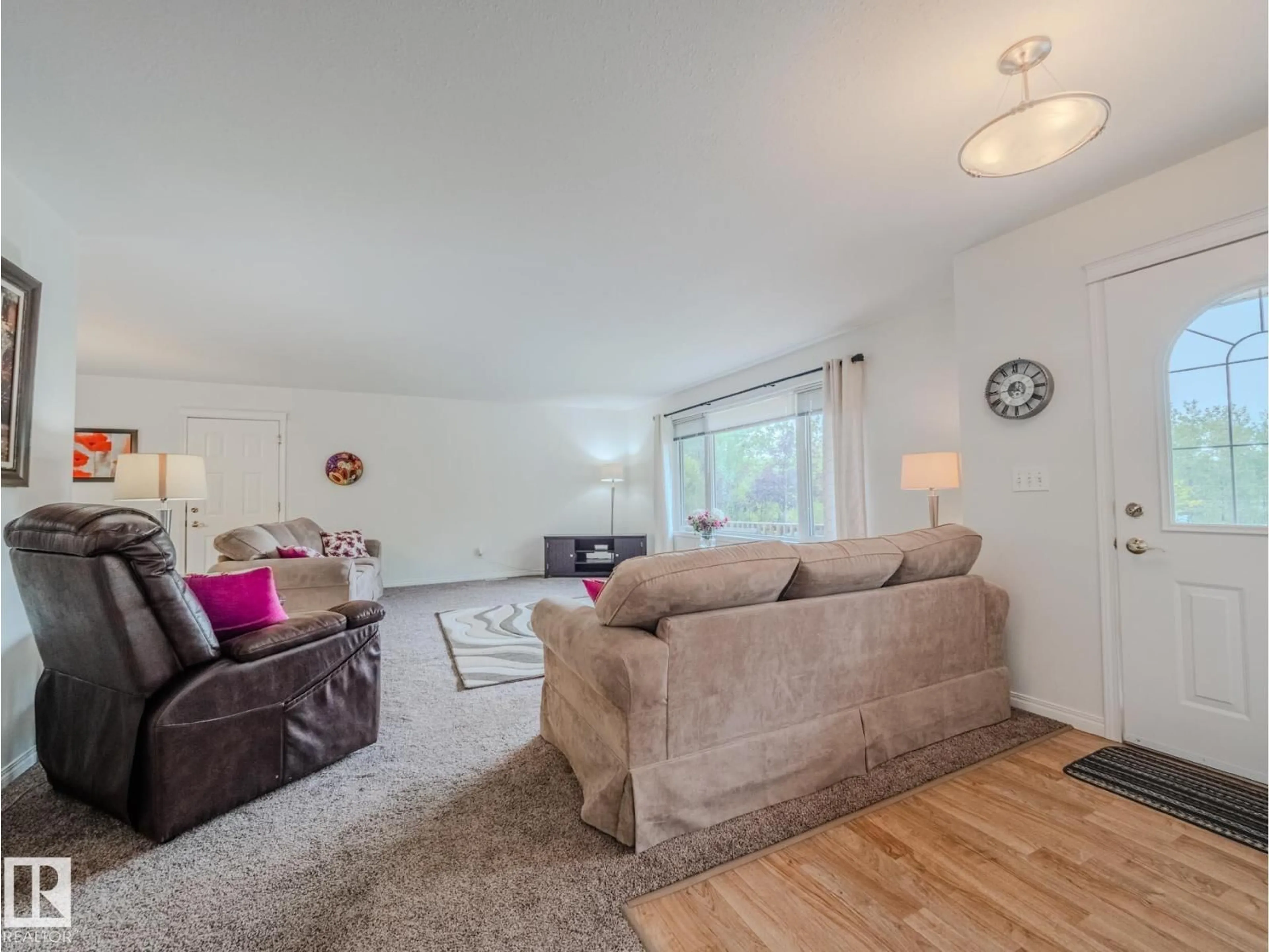 Living room with furniture, wood/laminate floor for 266 52122 RGE ROAD 210, Rural Strathcona County Alberta T8G1A4
