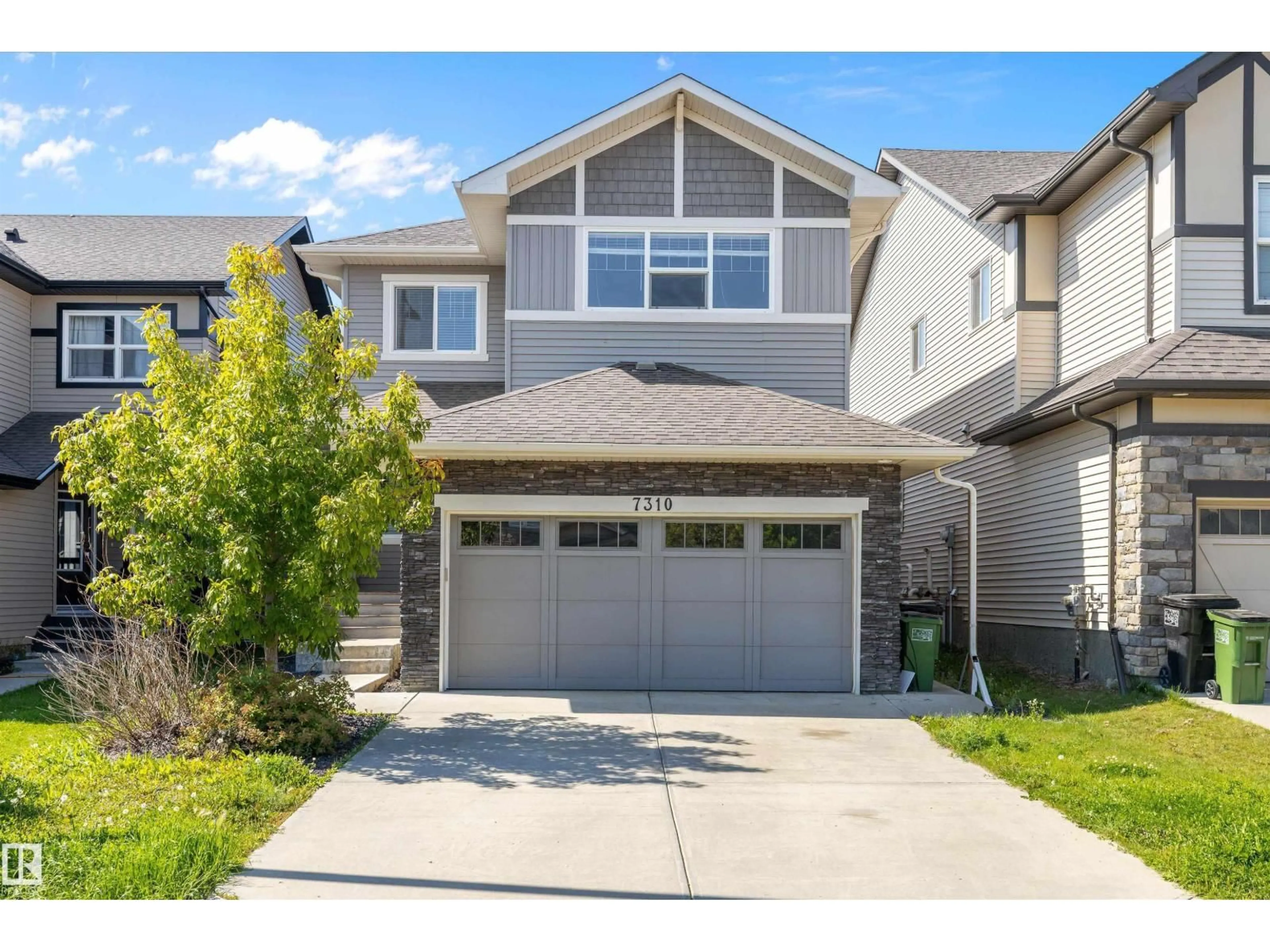 Home with vinyl exterior material, street for 7310 EDGEMONT WY, Edmonton Alberta T6M0S1