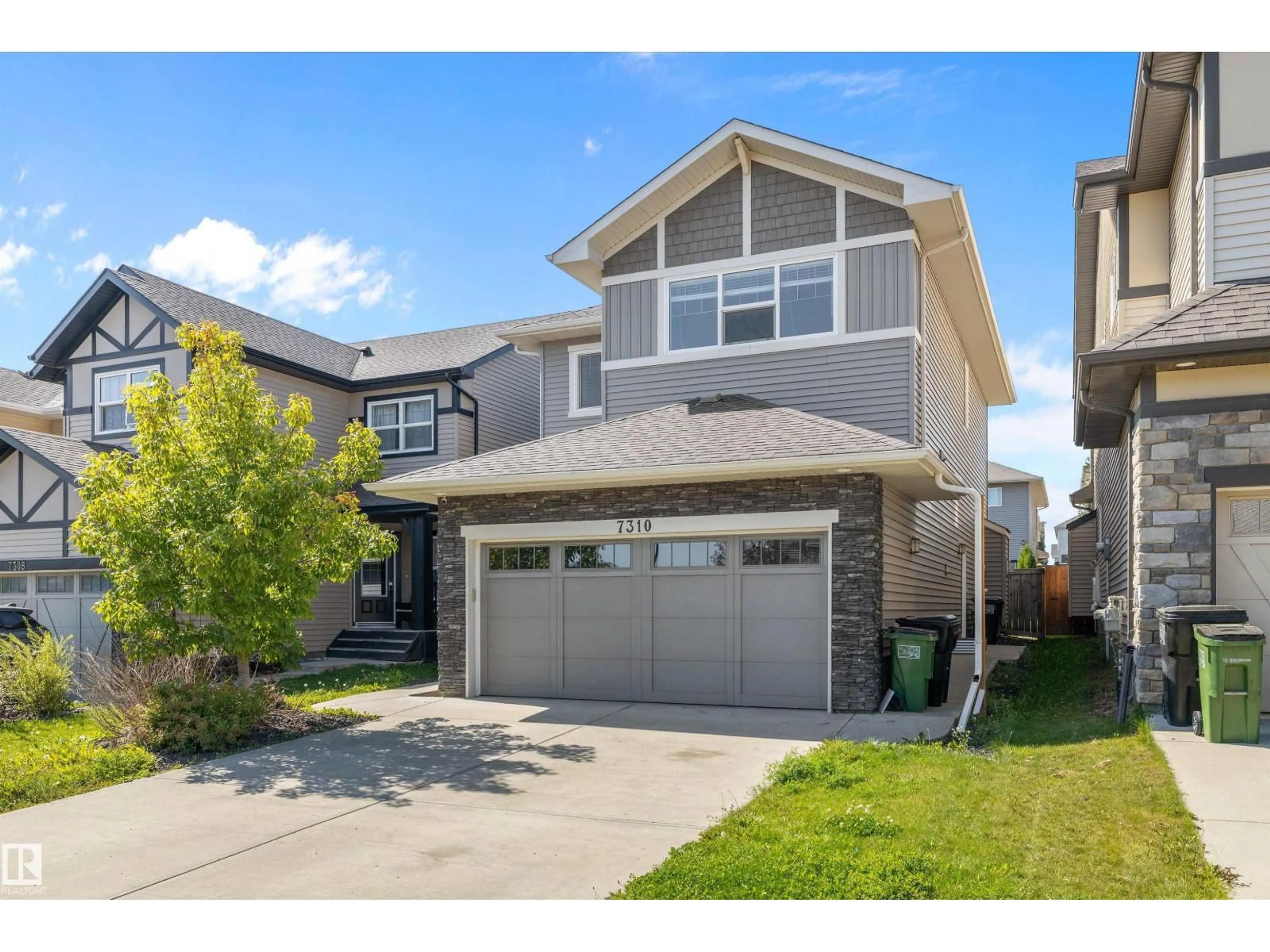 Home with vinyl exterior material, street for 7310 EDGEMONT WY, Edmonton Alberta T6M0S1