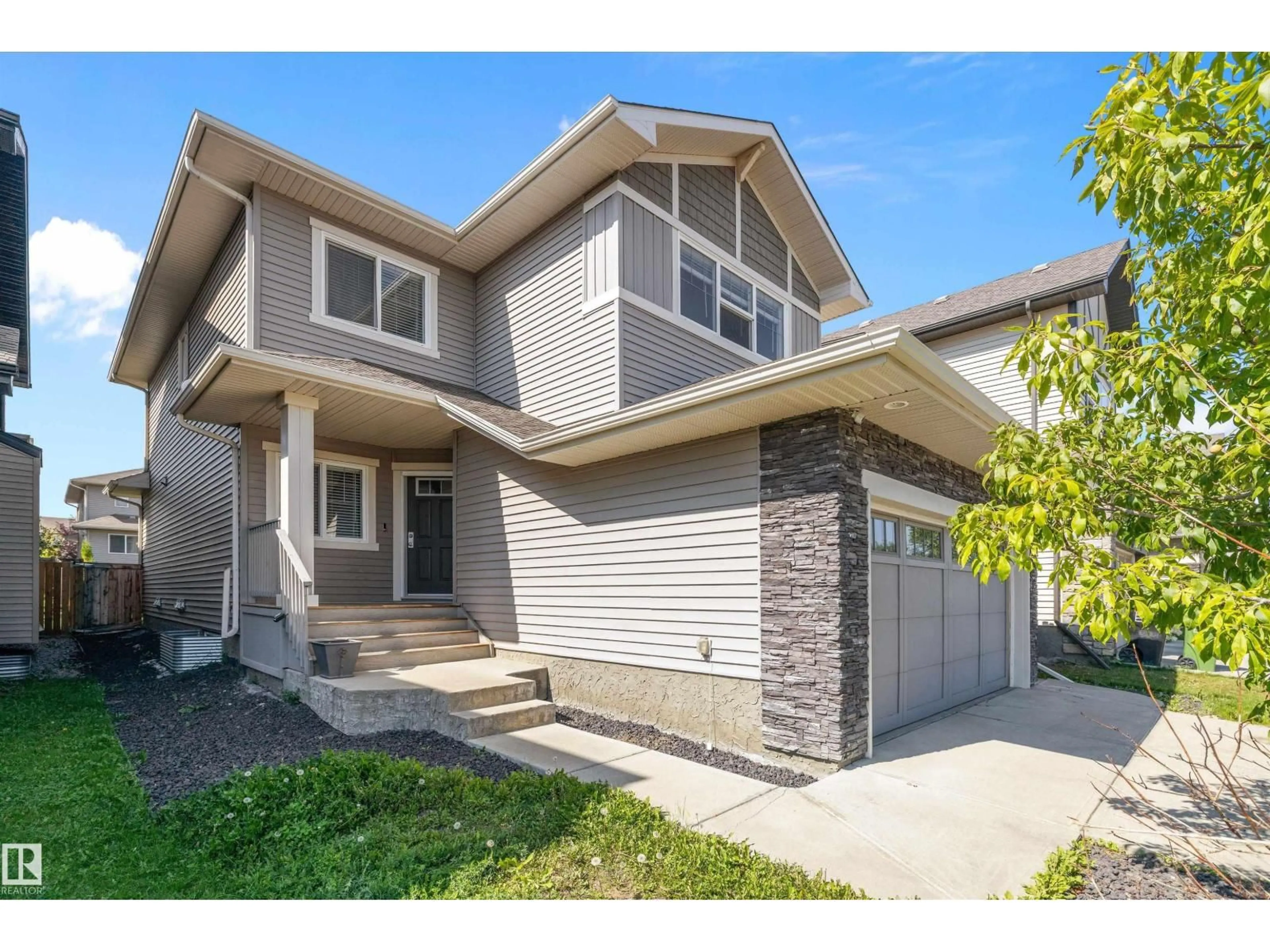 Home with vinyl exterior material, street for 7310 EDGEMONT WY, Edmonton Alberta T6M0S1