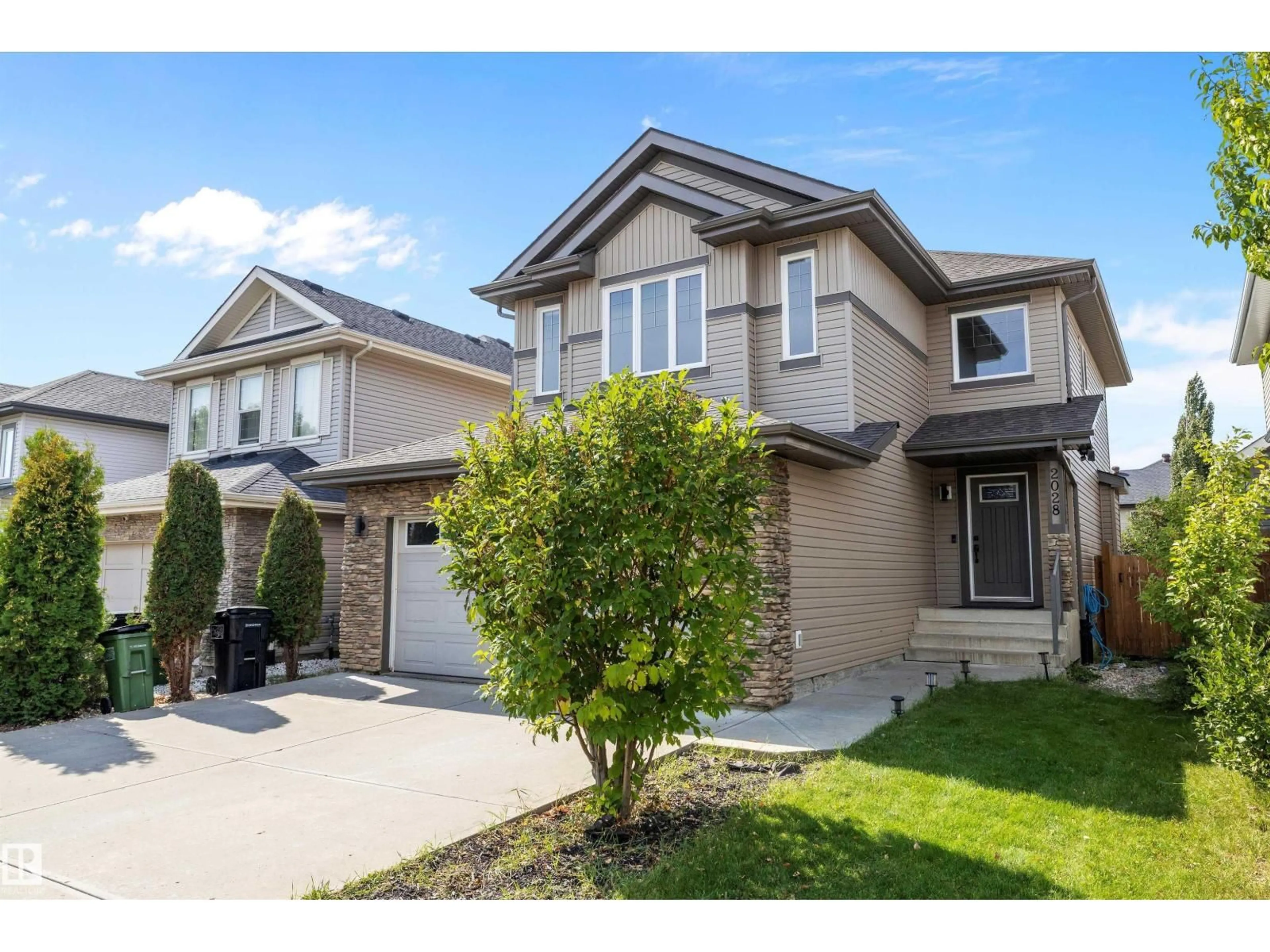 Home with vinyl exterior material, street for SW - 2028 69 ST, Edmonton Alberta T6X0S6