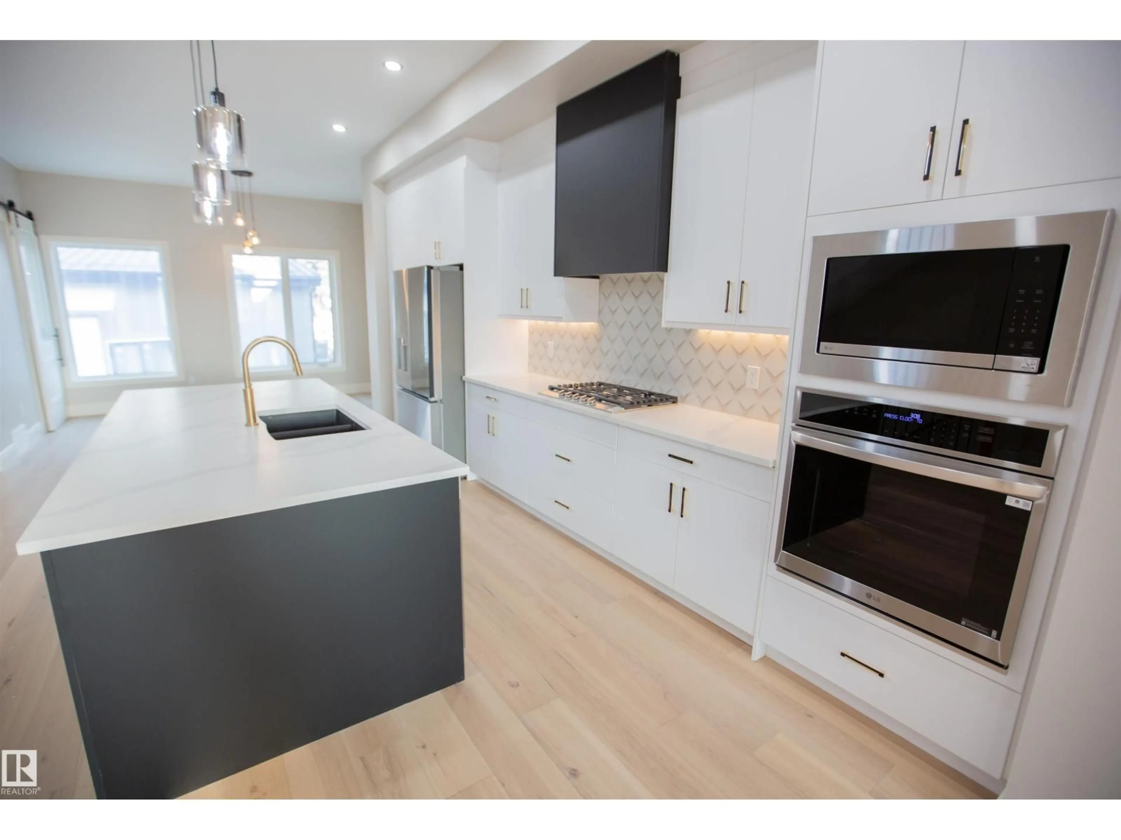 Open concept kitchen, wood/laminate floor for 9127 143 ST, Edmonton Alberta T5R0P5