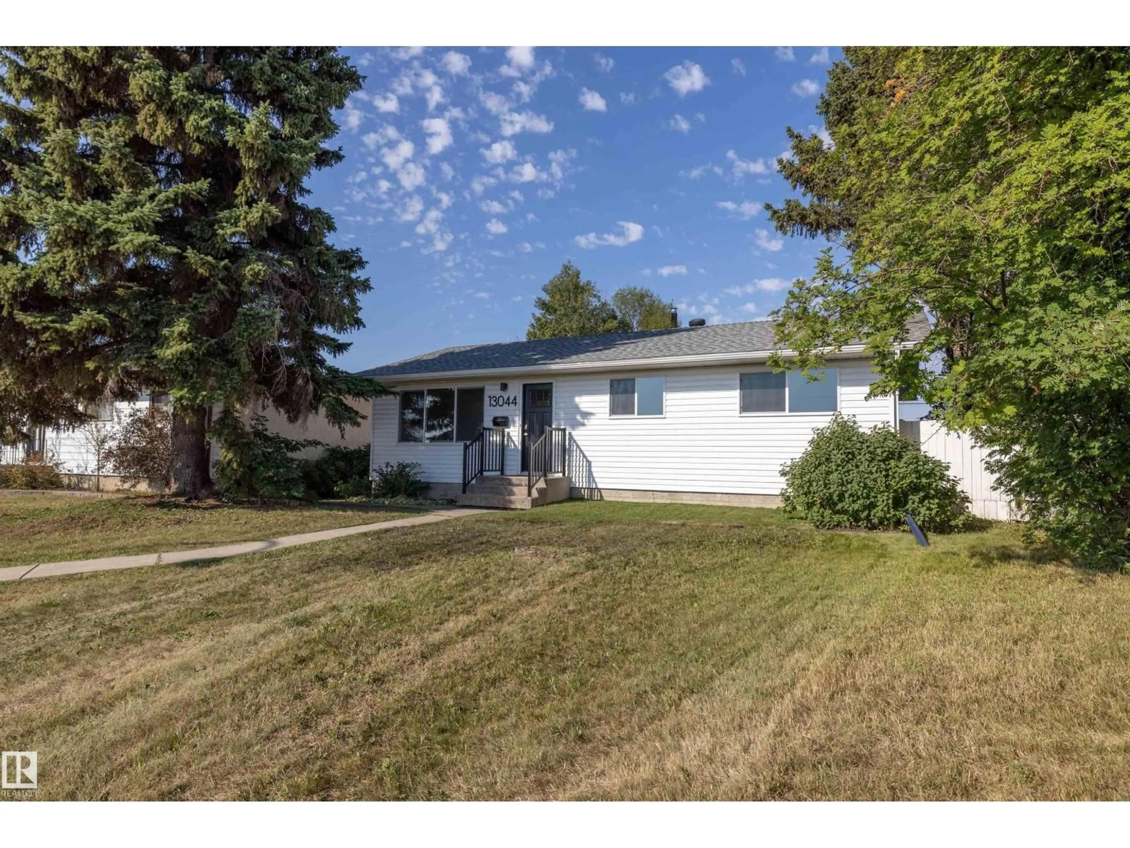 Home with vinyl exterior material, street for 13044 78 ST, Edmonton Alberta T5C2A1