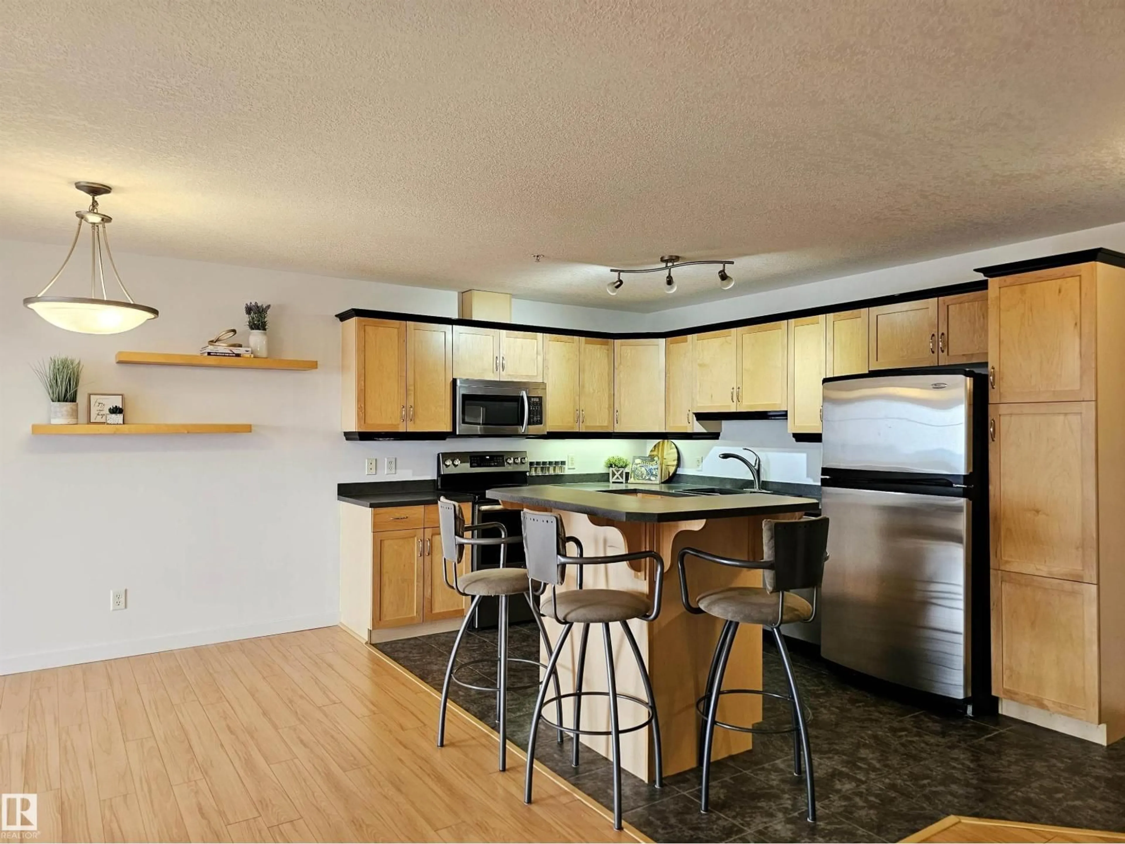 Open concept kitchen, wood/laminate floor for 78A - 429 MCKENNEY AV, St. Albert Alberta T8N7E6
