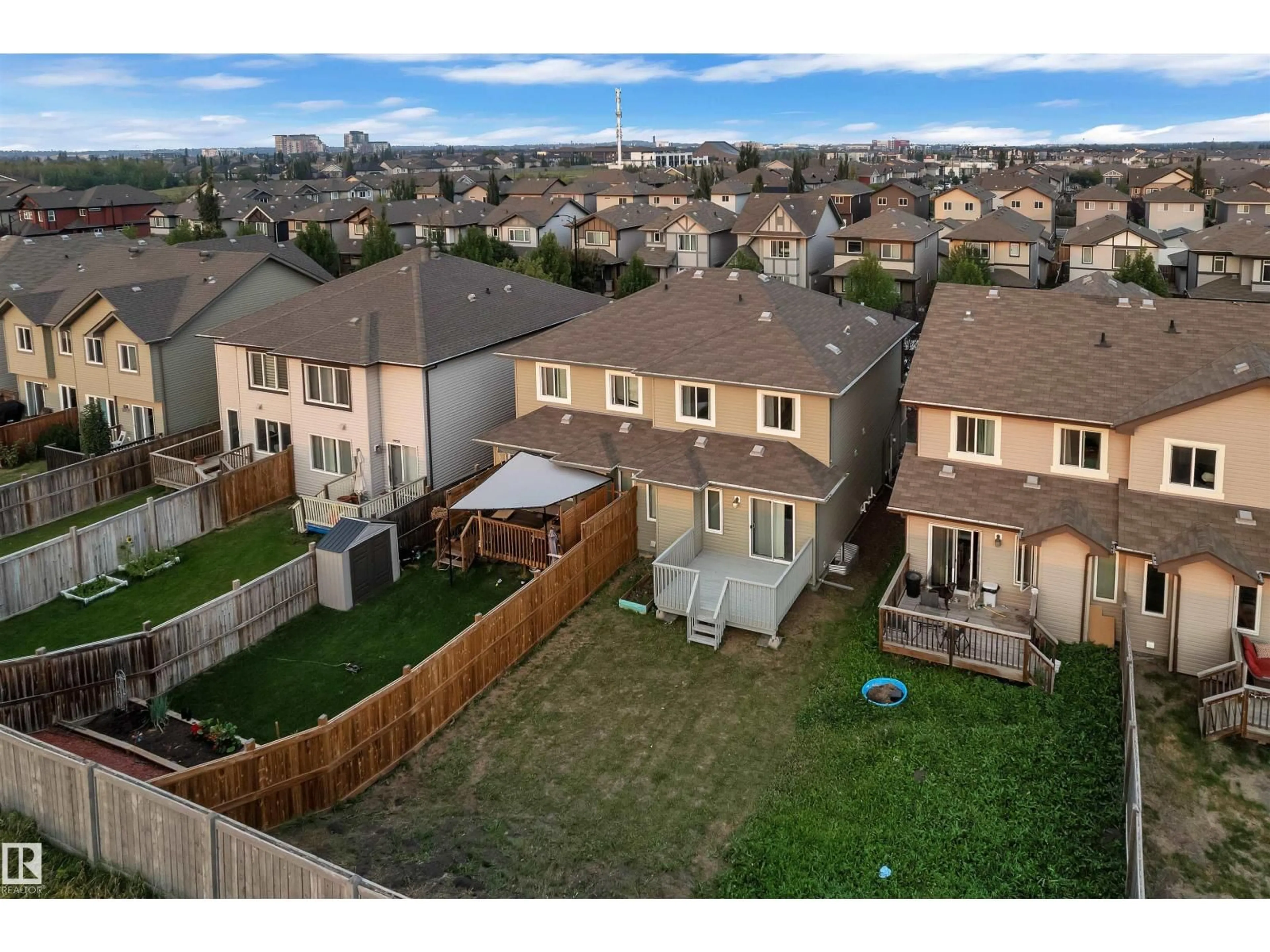 A pic from outside/outdoor area/front of a property/back of a property/a pic from drone, mountain view for SW - 7301 ARMOUR CR, Edmonton Alberta T6W2S2