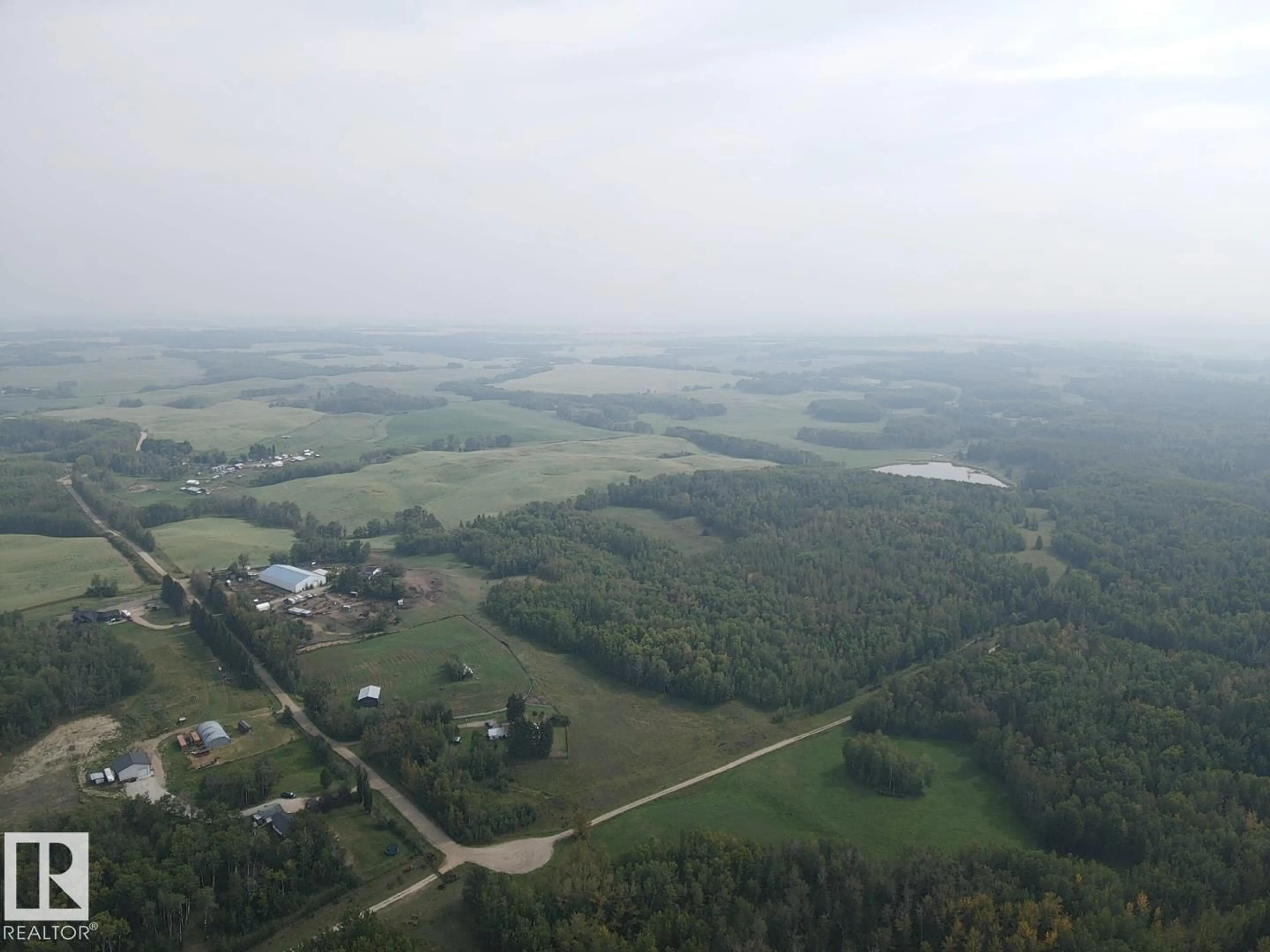 A pic from outside/outdoor area/front of a property/back of a property/a pic from drone, mountain view for 2507 TWP ROAD 513, Rural Parkland County Alberta T7Y3H8