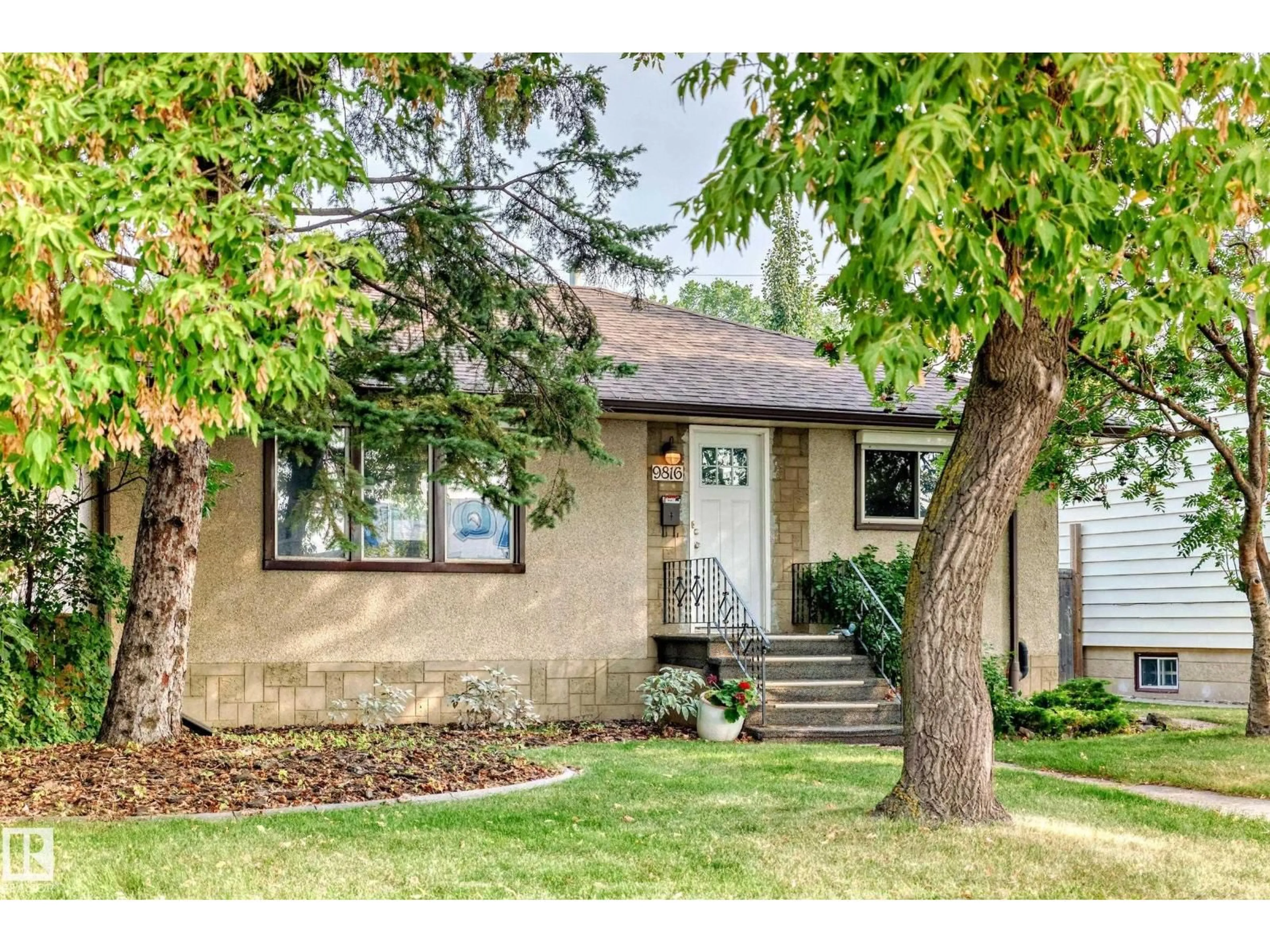 Home with vinyl exterior material, street for 9816 63 AV, Edmonton Alberta T6E0G6
