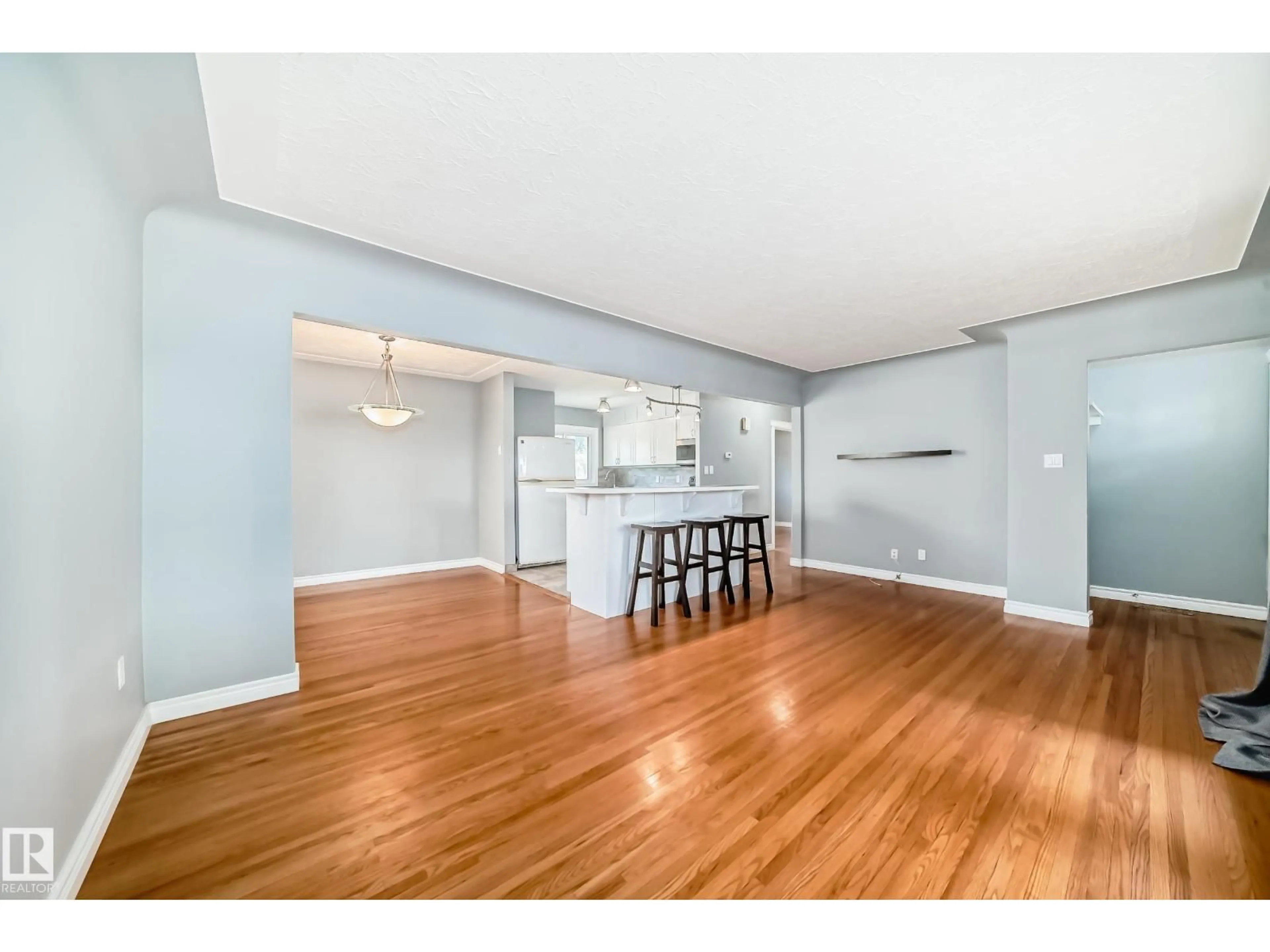 Open concept kitchen, wood/laminate floor for 9816 63 AV, Edmonton Alberta T6E0G6